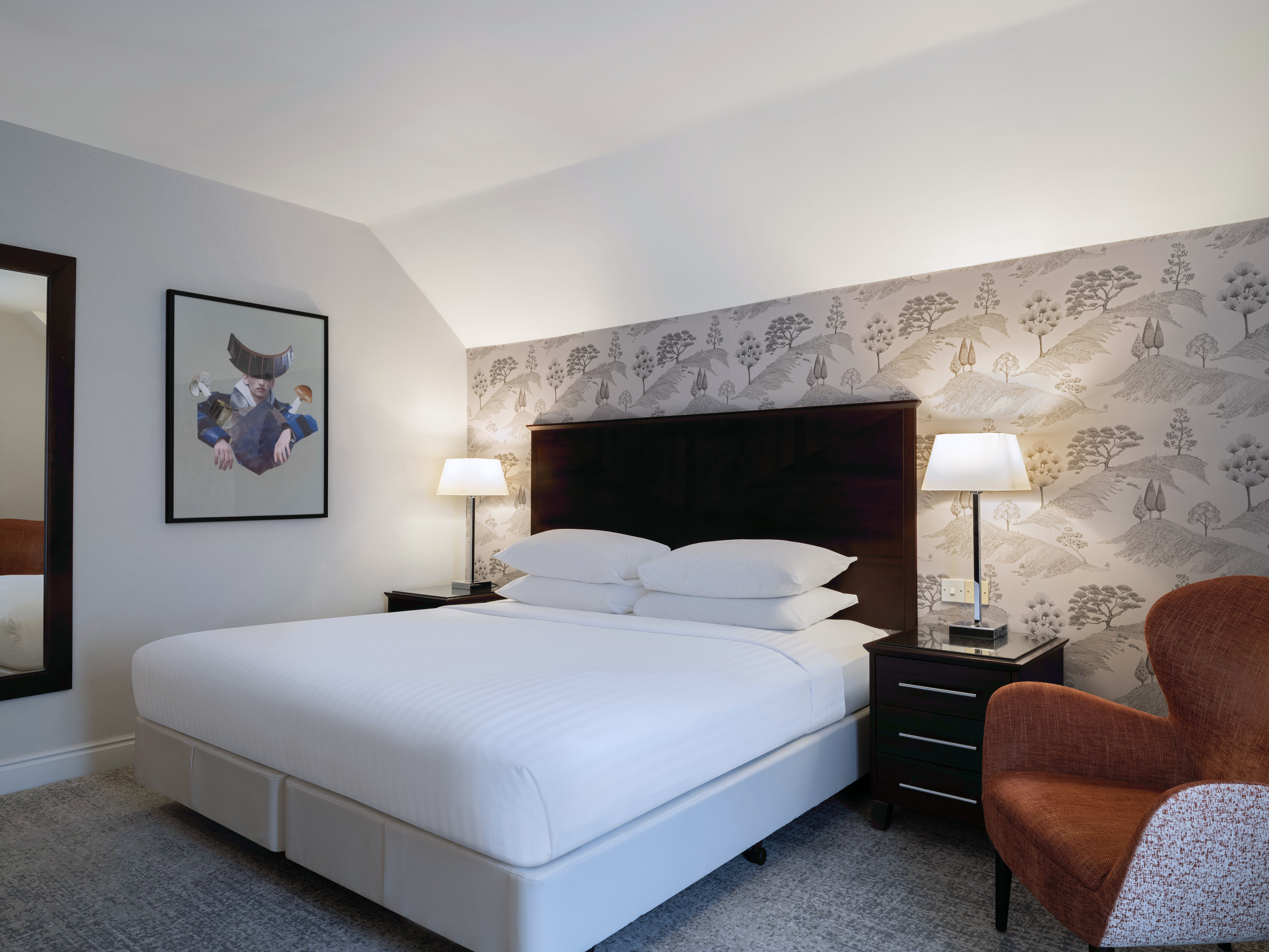 Worsley Suite hotel room with modern design, perfect for business events and relaxation.