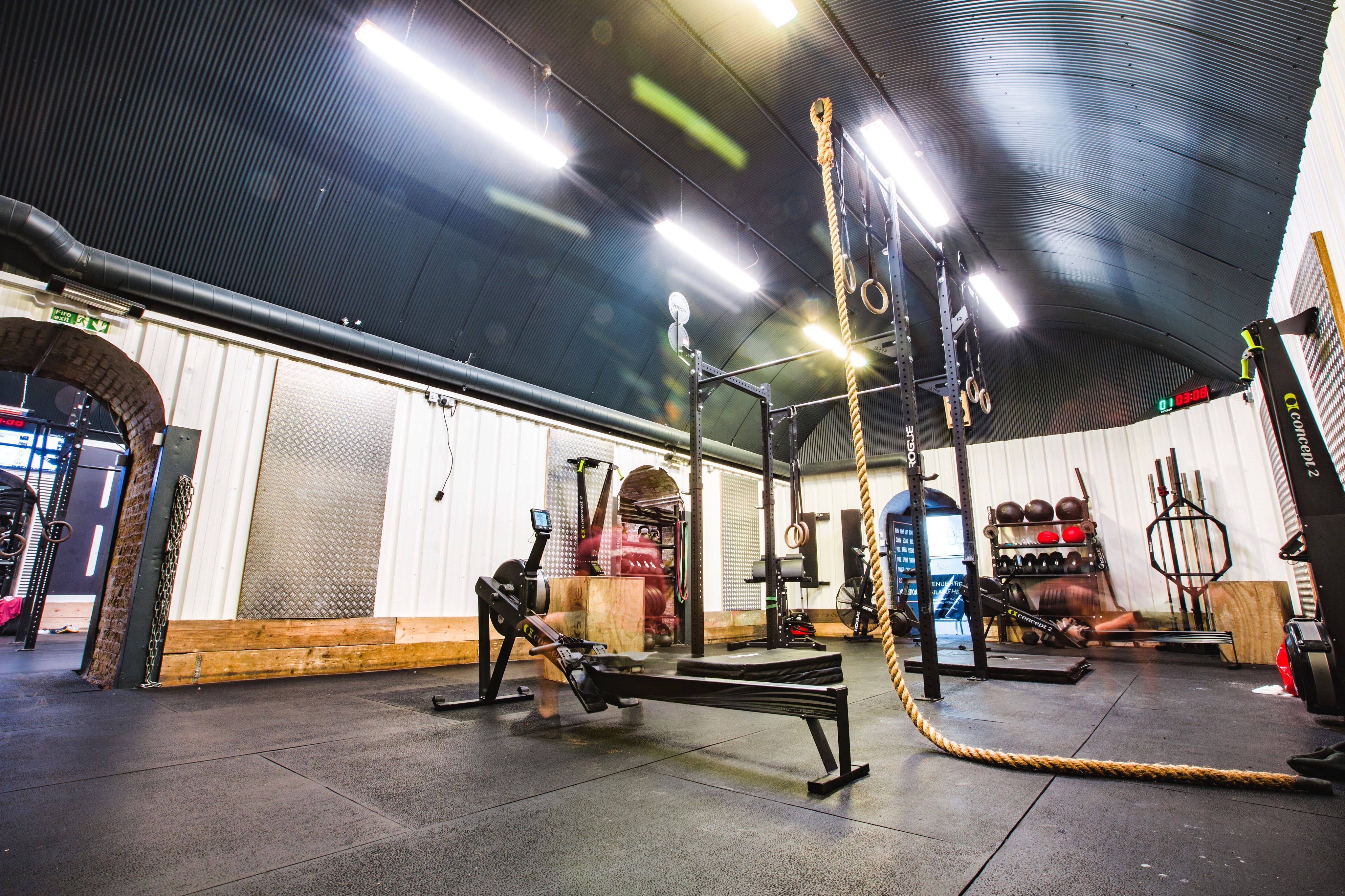CrossFit Shapesmiths: versatile fitness space with rowing machines for corporate wellness events.