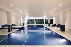 Modern indoor pool at Mercure Cardiff for elegant networking events and retreats.
