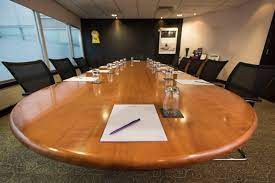 Pembroke Suite conference room with oval table, ideal for meetings in Cardiff.