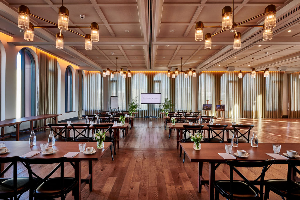 Elegant meeting space with natural light and greenery at Cleaver & Wake.