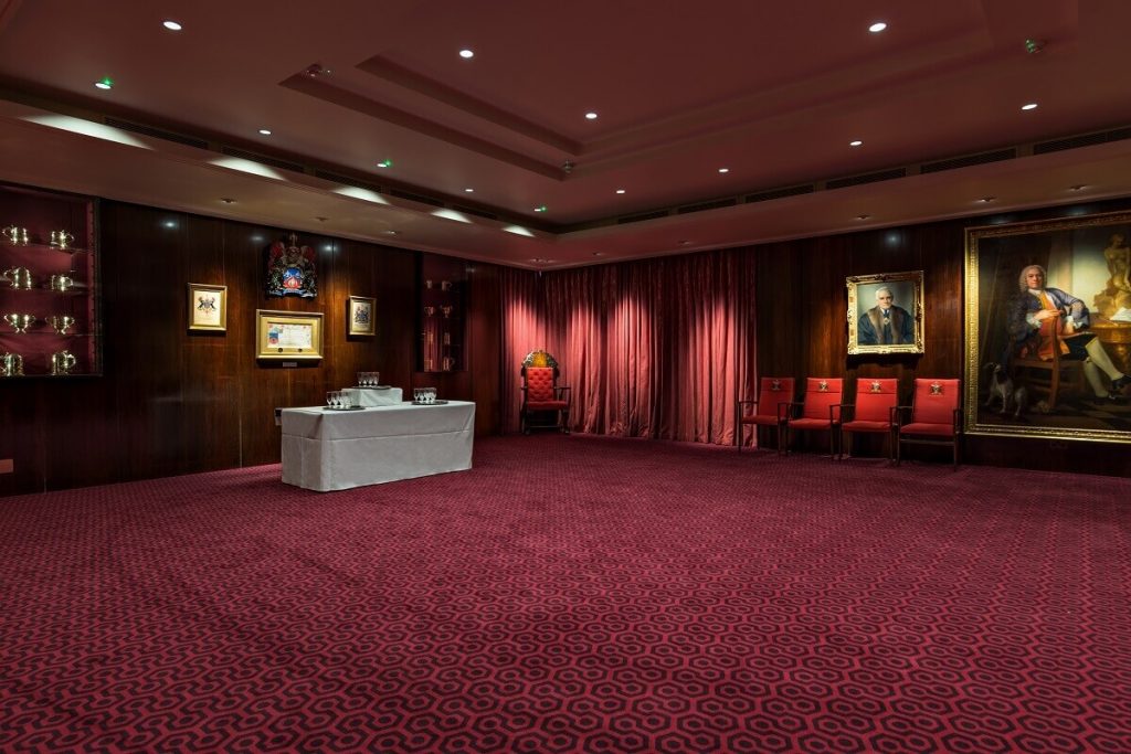 Traditional courtroom boardroom with plush seating for formal meetings and ceremonial events.