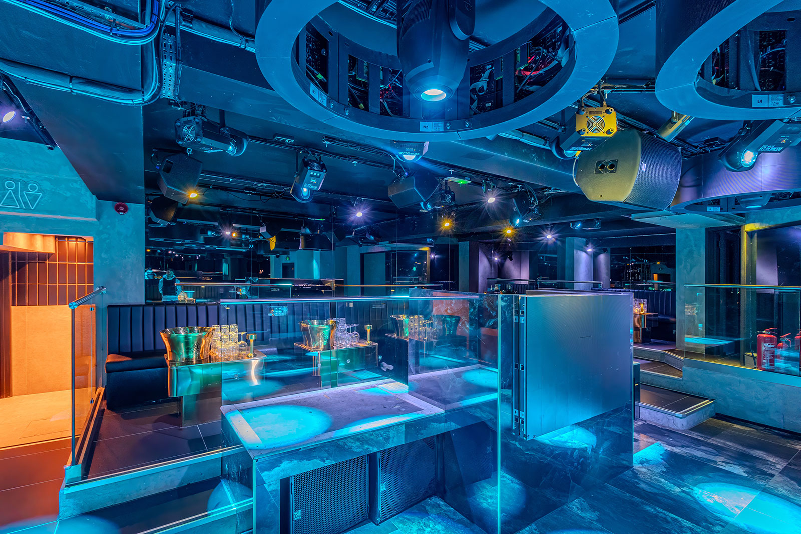 Modern event space with ambient lighting, ideal for corporate gatherings and celebrations.