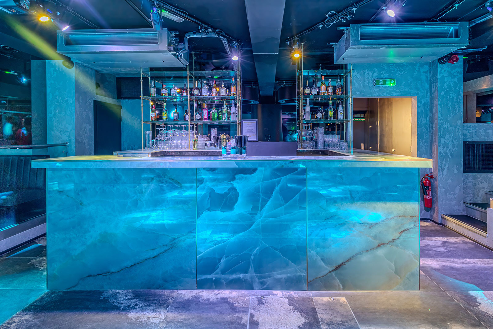 Sleek bar with illuminated countertop, perfect for upscale events and cocktail receptions.