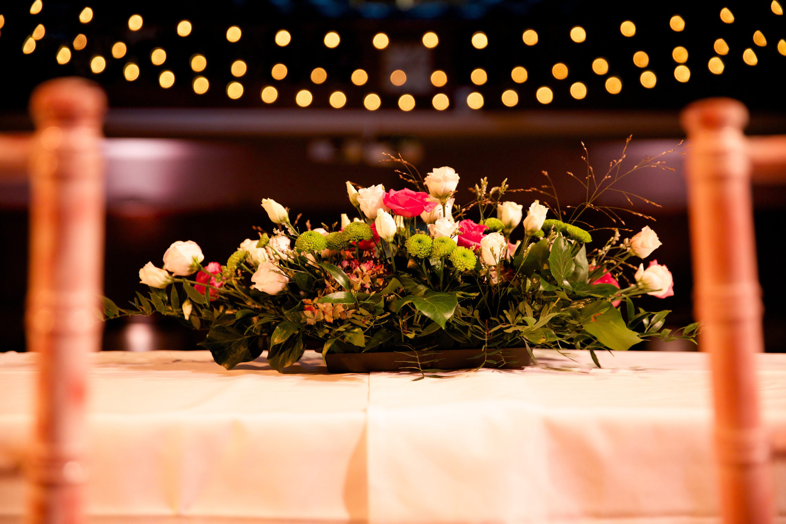 Floral centerpiece at Conway Hall wedding with soft lighting ambiance.
