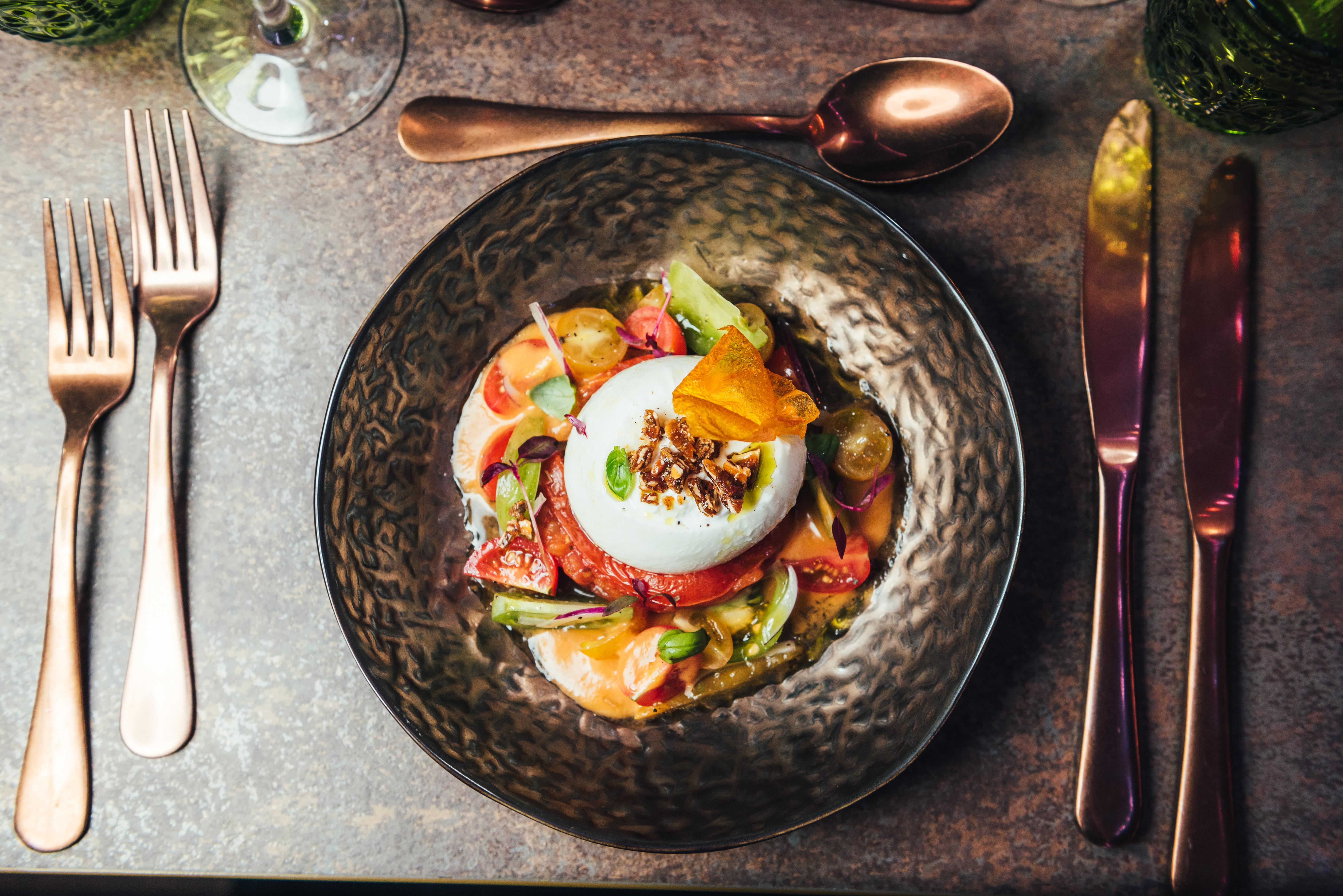 Elegant plated dish at Club Royale London, perfect for upscale dining events.