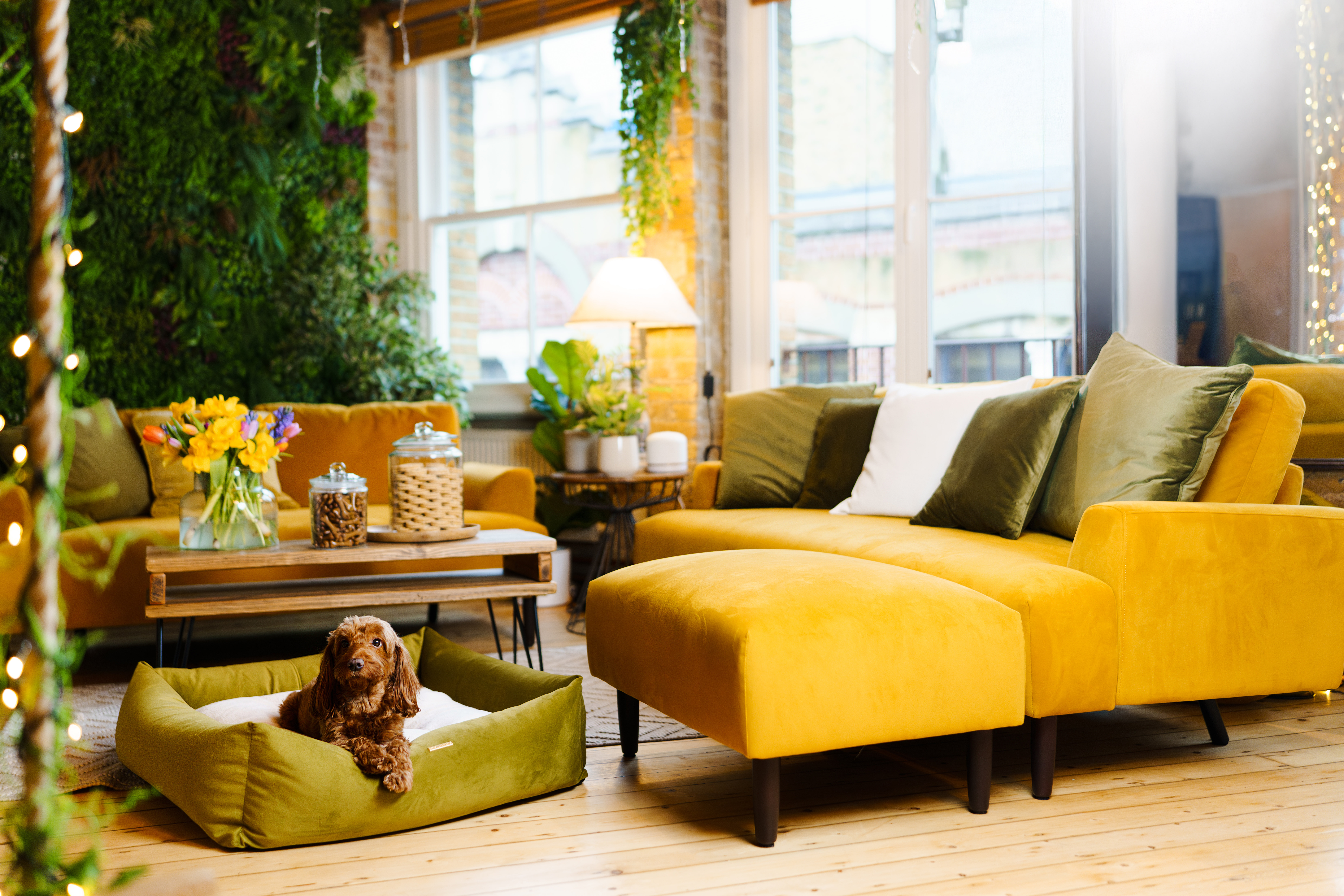 Cozy Shoreditch Treehouse lounge with vibrant yellow decor, ideal for networking events.