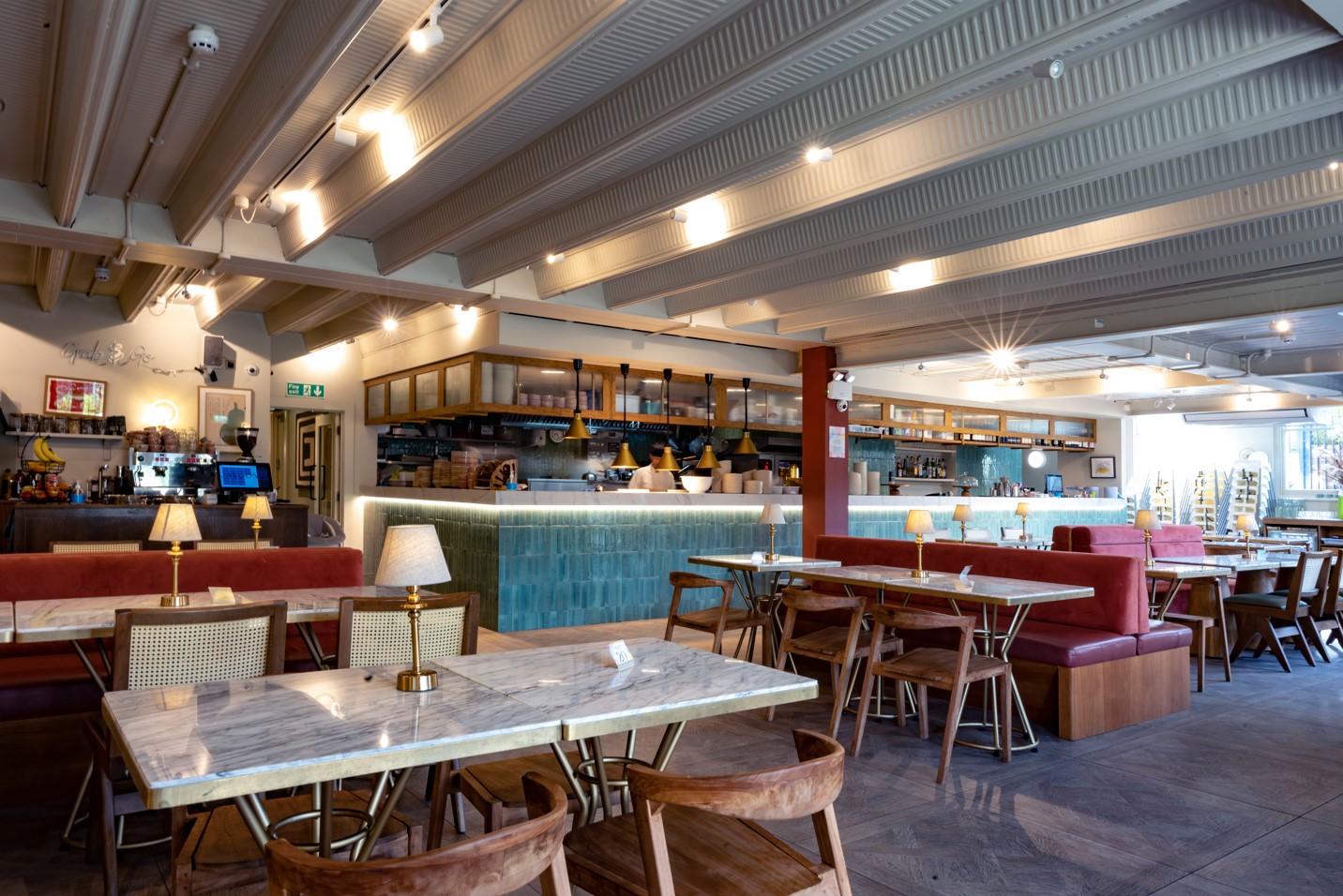 Modern event venue in Jaego's House with stylish seating and bright bar area.