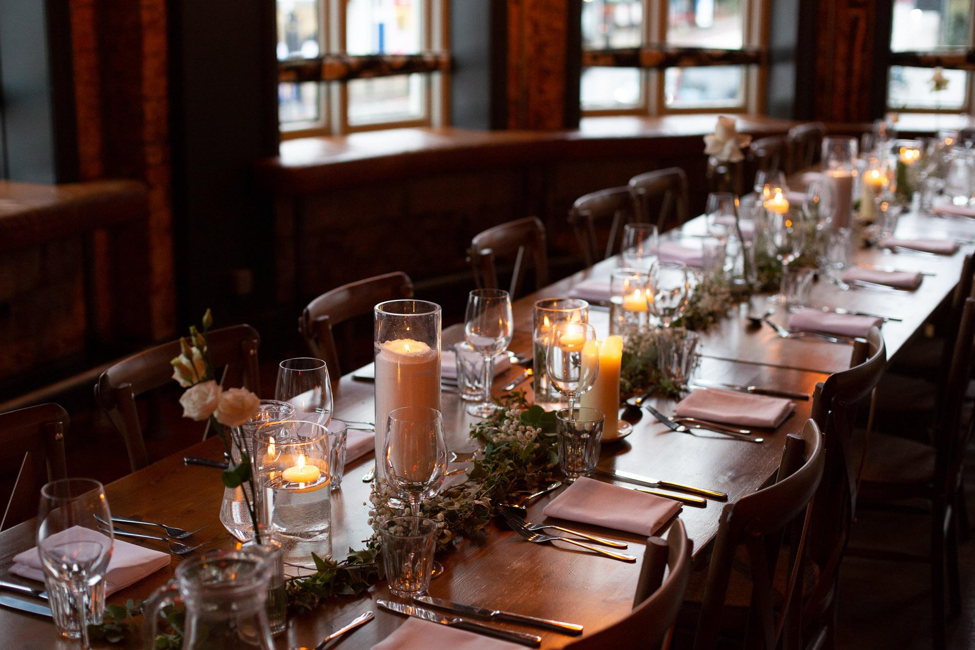 Elegant dining table with candlelight for intimate events at The Railway's First Floor Lounge.
