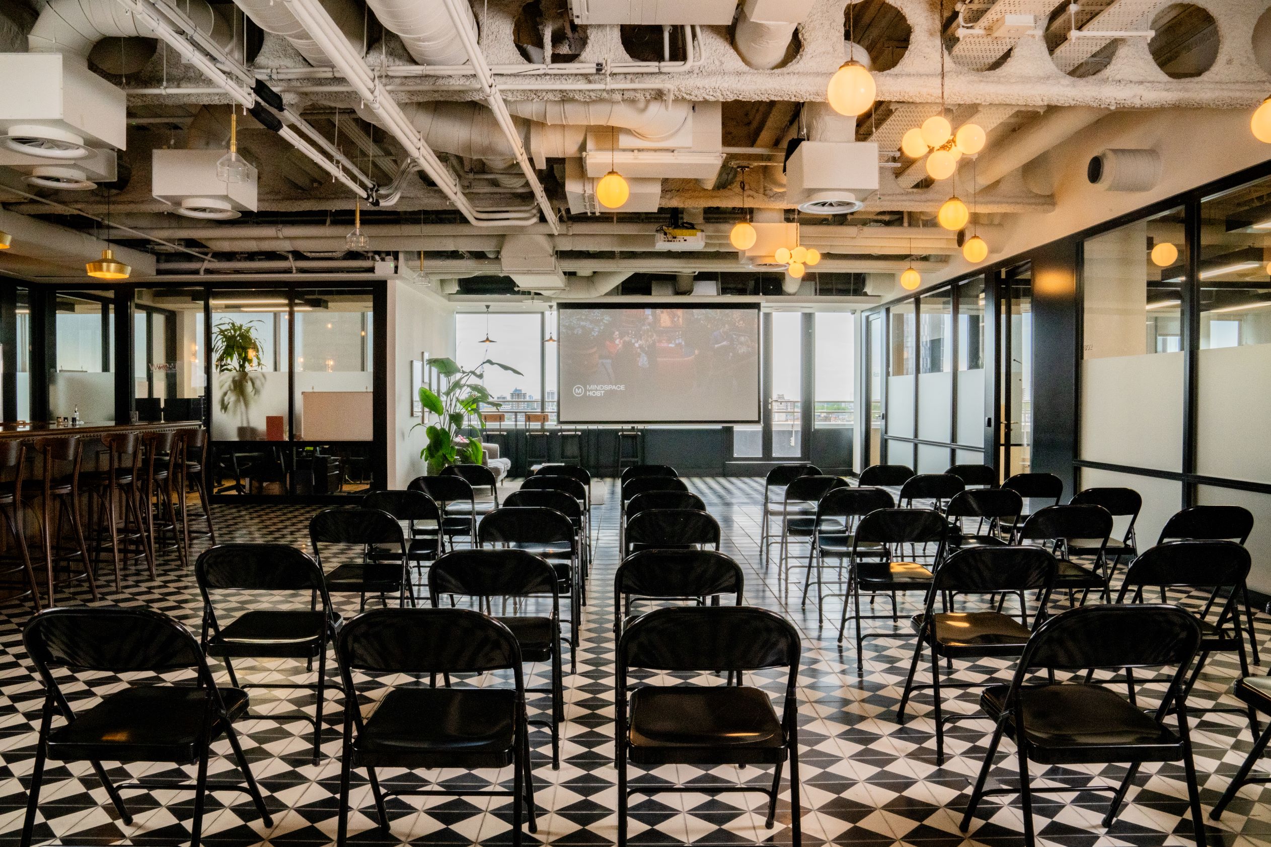 Liverpool Street Event Space with black chairs, ideal for corporate meetings and workshops.