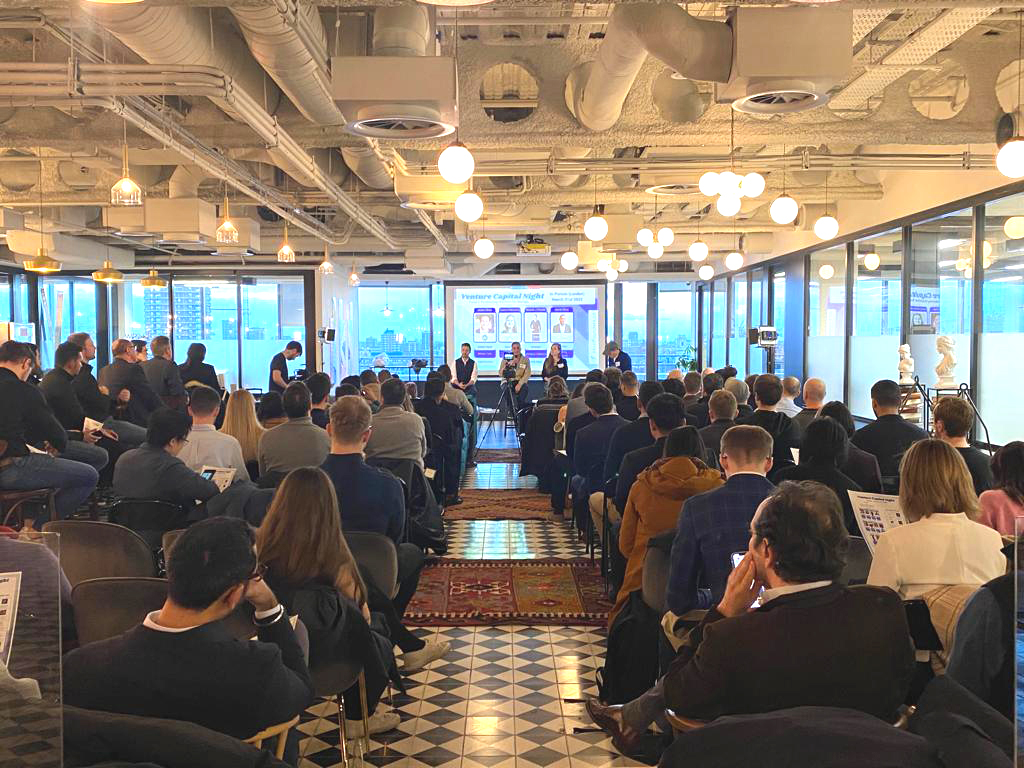 Liverpool Street Event Space panel discussion with diverse speakers and natural light.