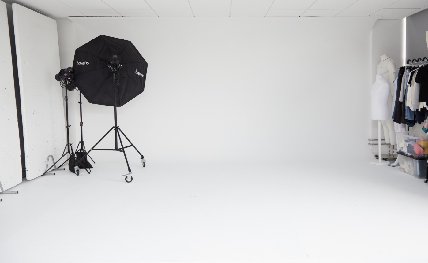 Versatile event space with clean backdrop for fashion photoshoots and gatherings.