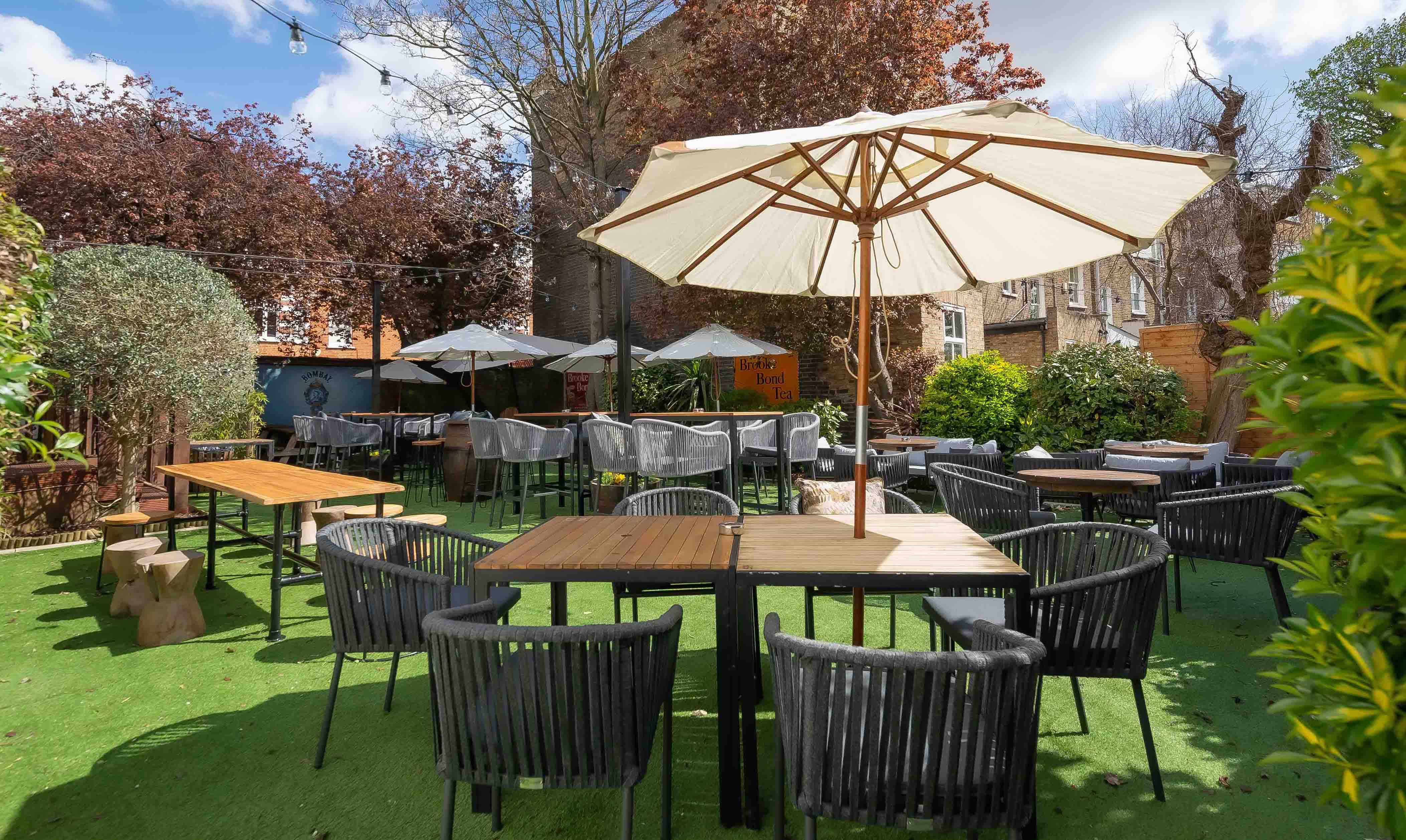 Charming outdoor event space at The Boathouse, ideal for summer gatherings and networking.