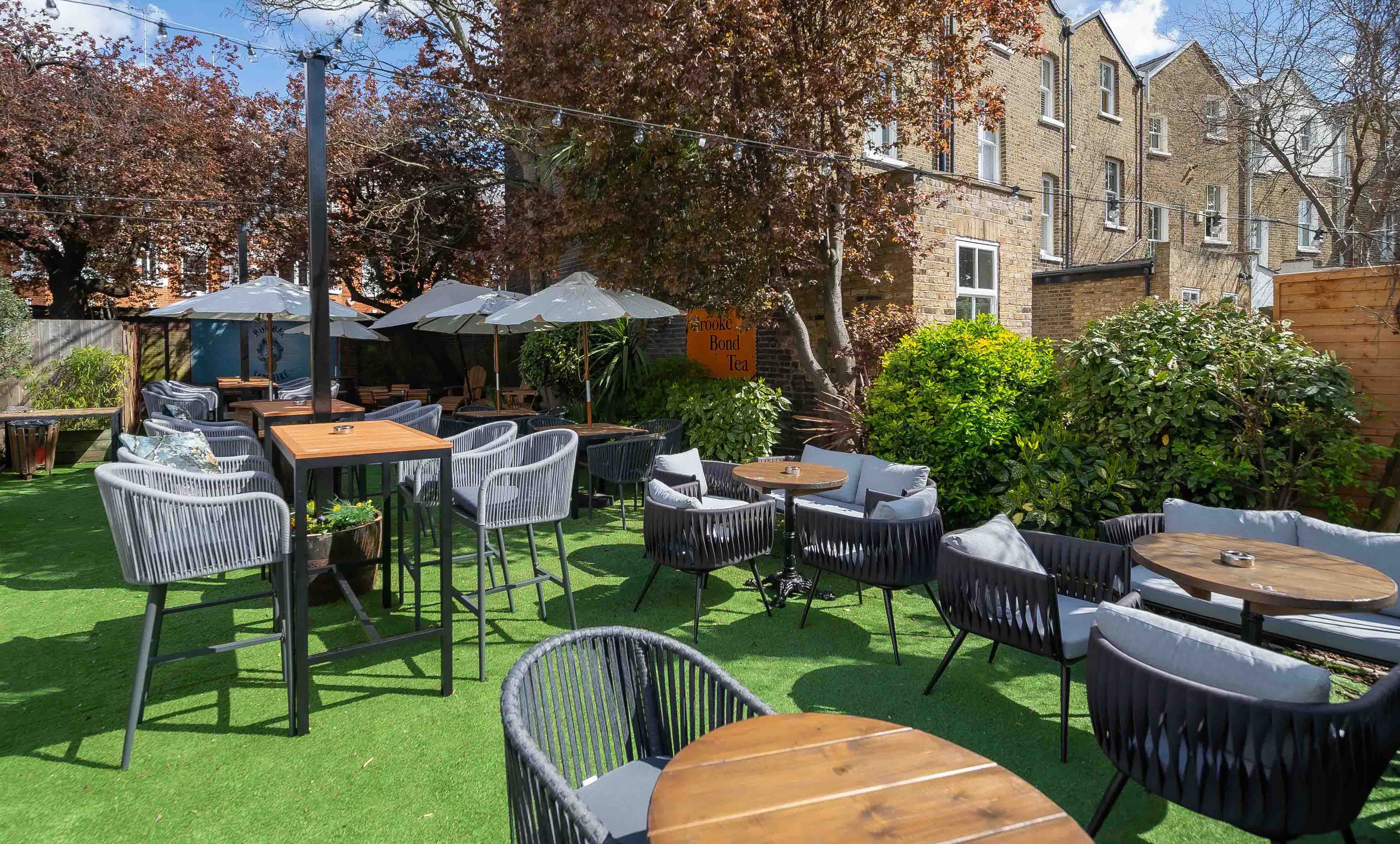 Charming outdoor venue at The Boathouse, ideal for casual meetings and events.