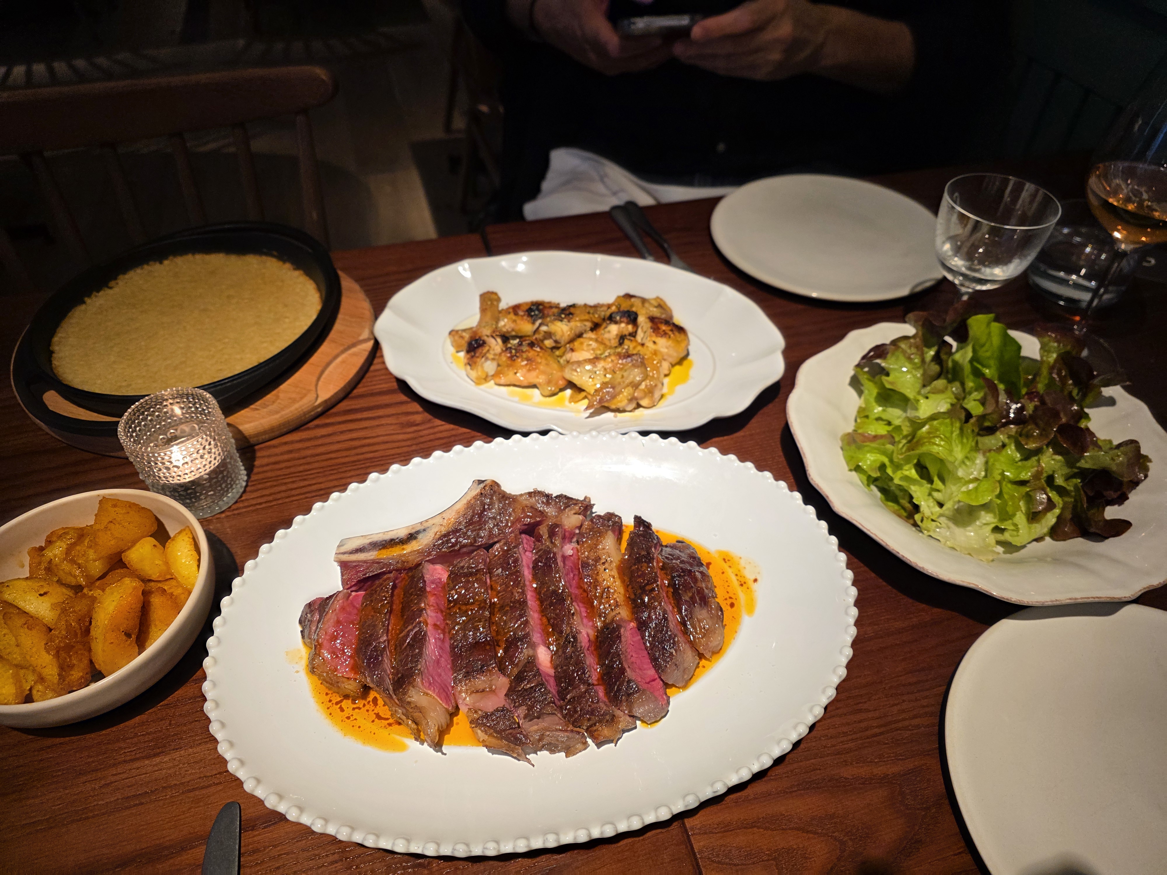 Upscale dining table with gourmet dishes in Curtain Room, Luso for corporate events.