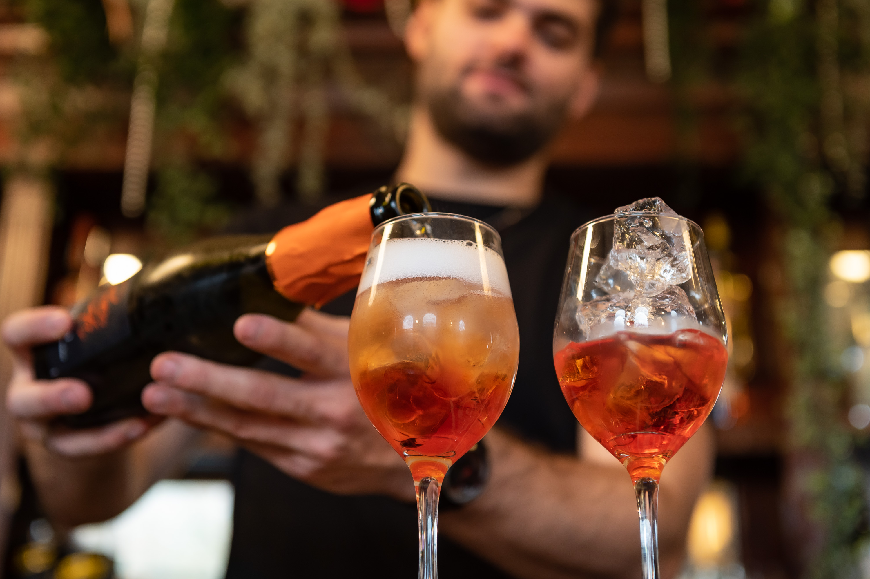 Bartender pouring sparkling drinks at The Bridge, Barnes - elegant venue for events.