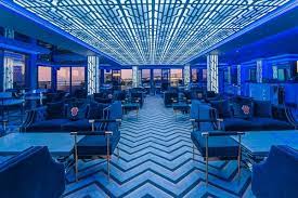Modern event space at Above Rooftop, Newcastle with blue ambiance and panoramic views.