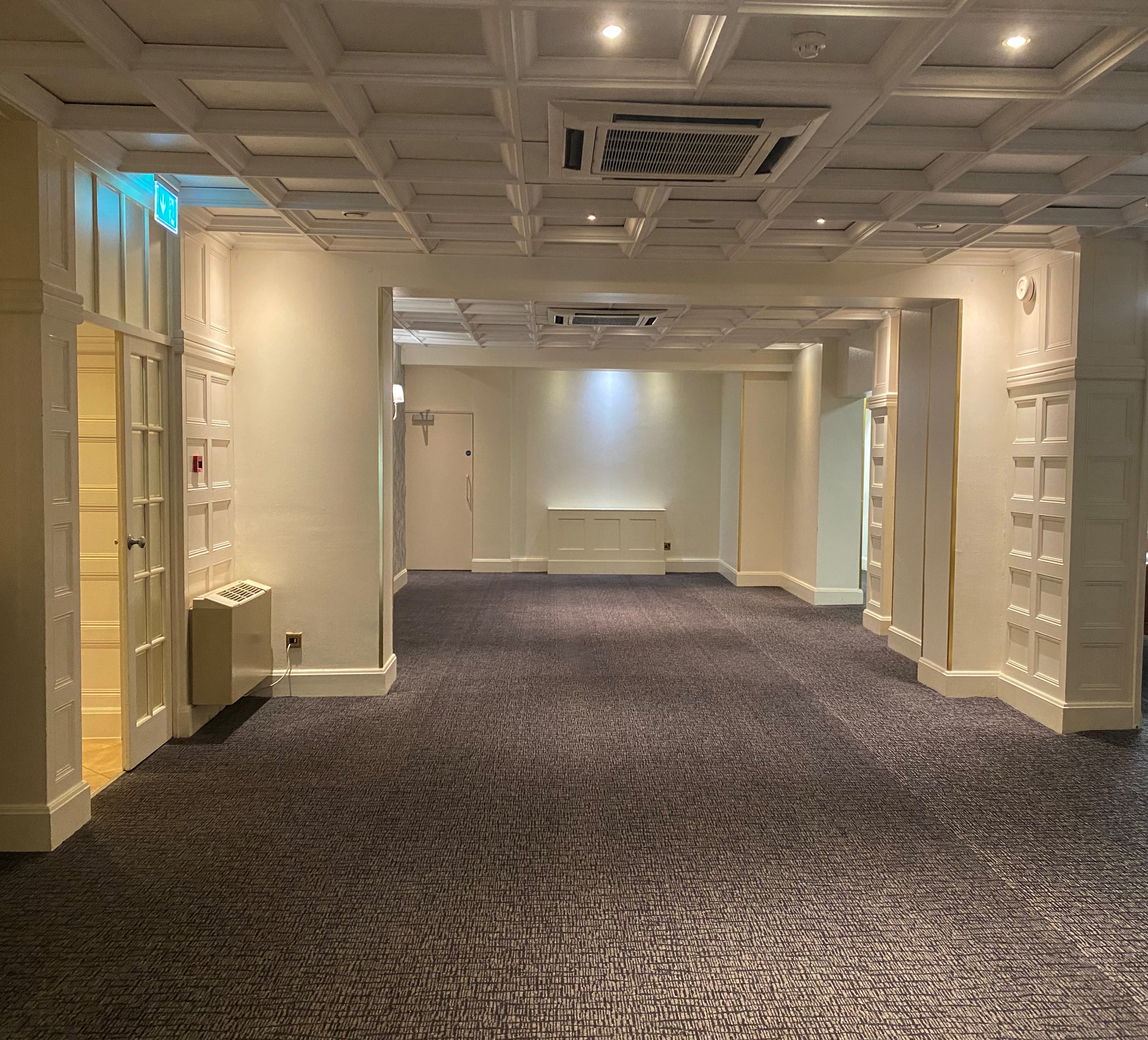 Versatile Manor room at Barton Manor Hotel, ideal for meetings and gatherings.