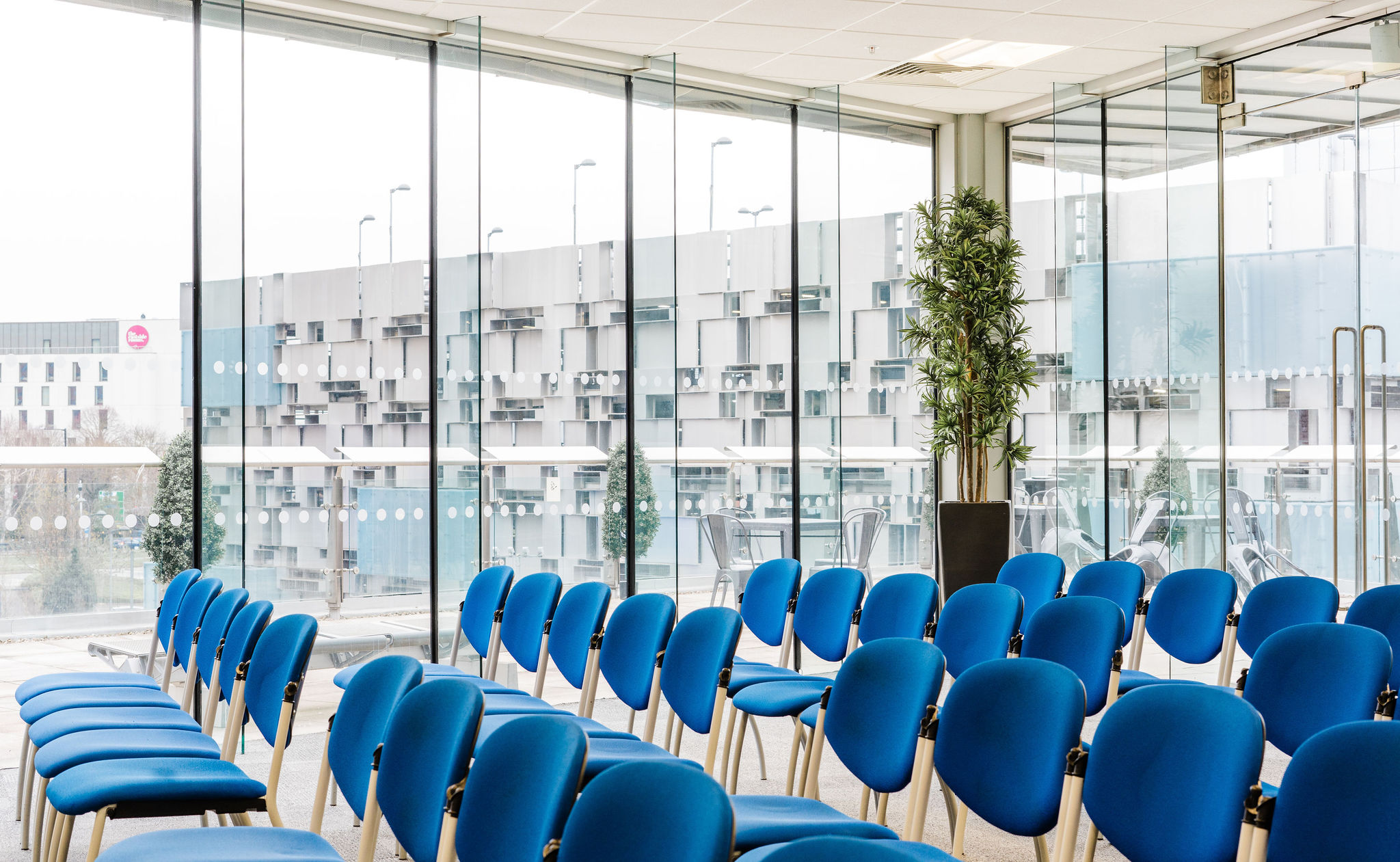 Curzon Suite at Millennium Point: modern event space with blue chairs for meetings.