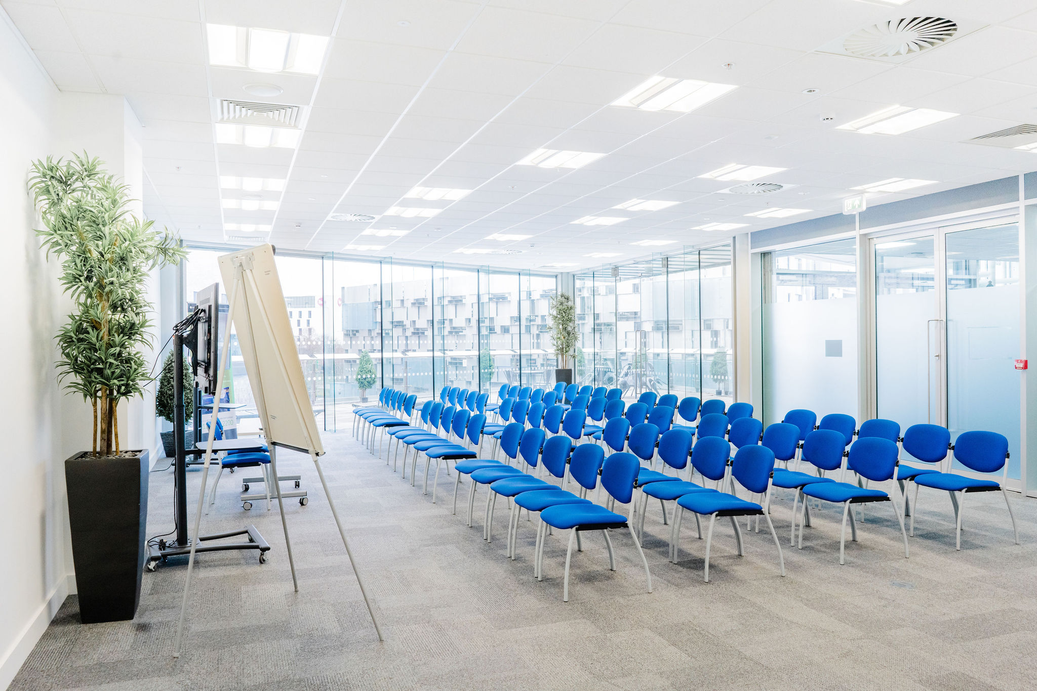 Curzon Suite at Millennium Point: bright meeting space with blue chairs for workshops.