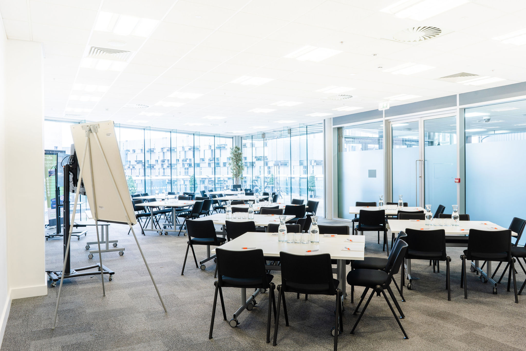 Curzon Suite at Millennium Point: bright meeting room with flexible tables for events.