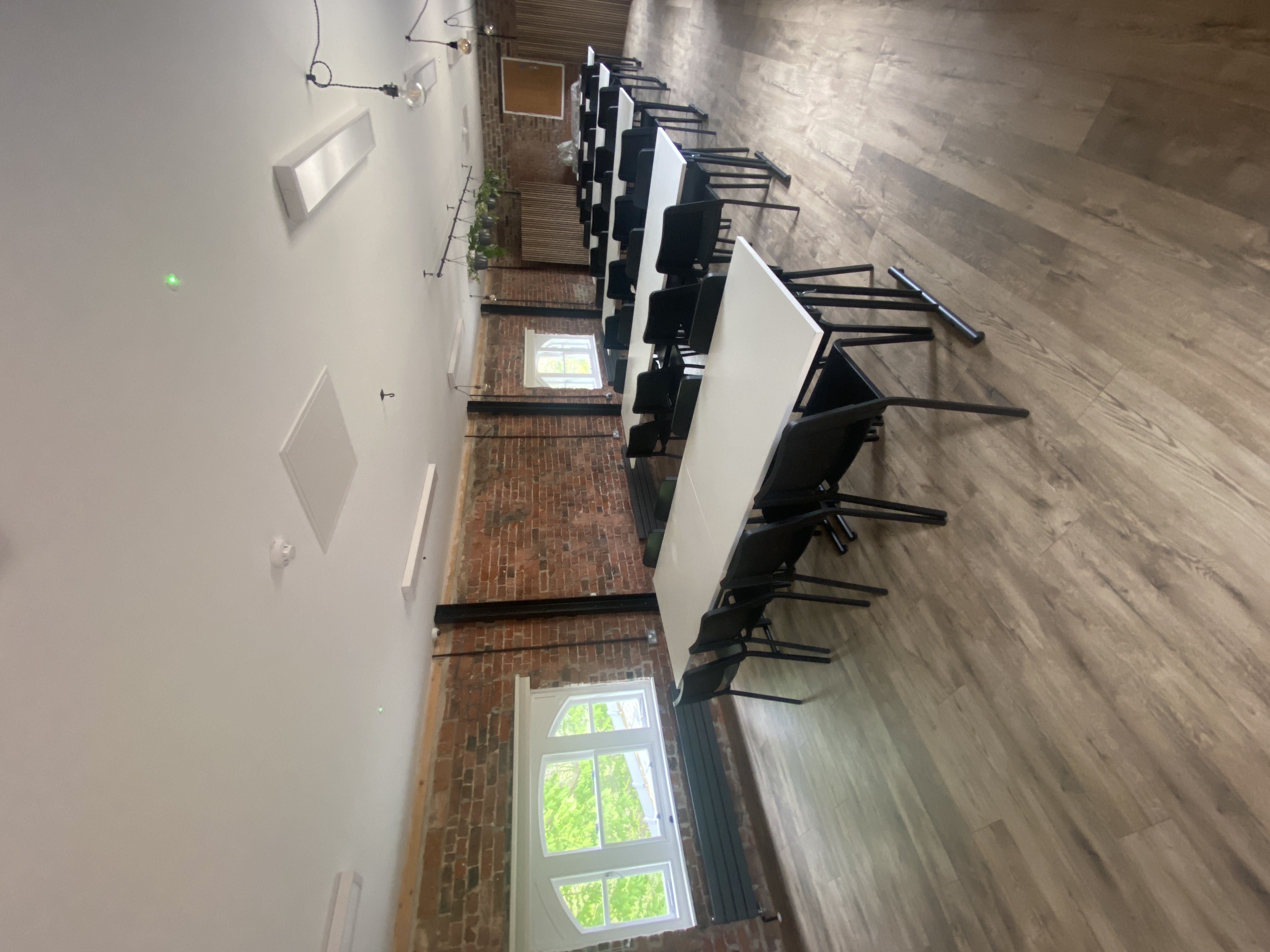 Modern meeting space at The Loft, Bowring Park; ideal for workshops and seminars.