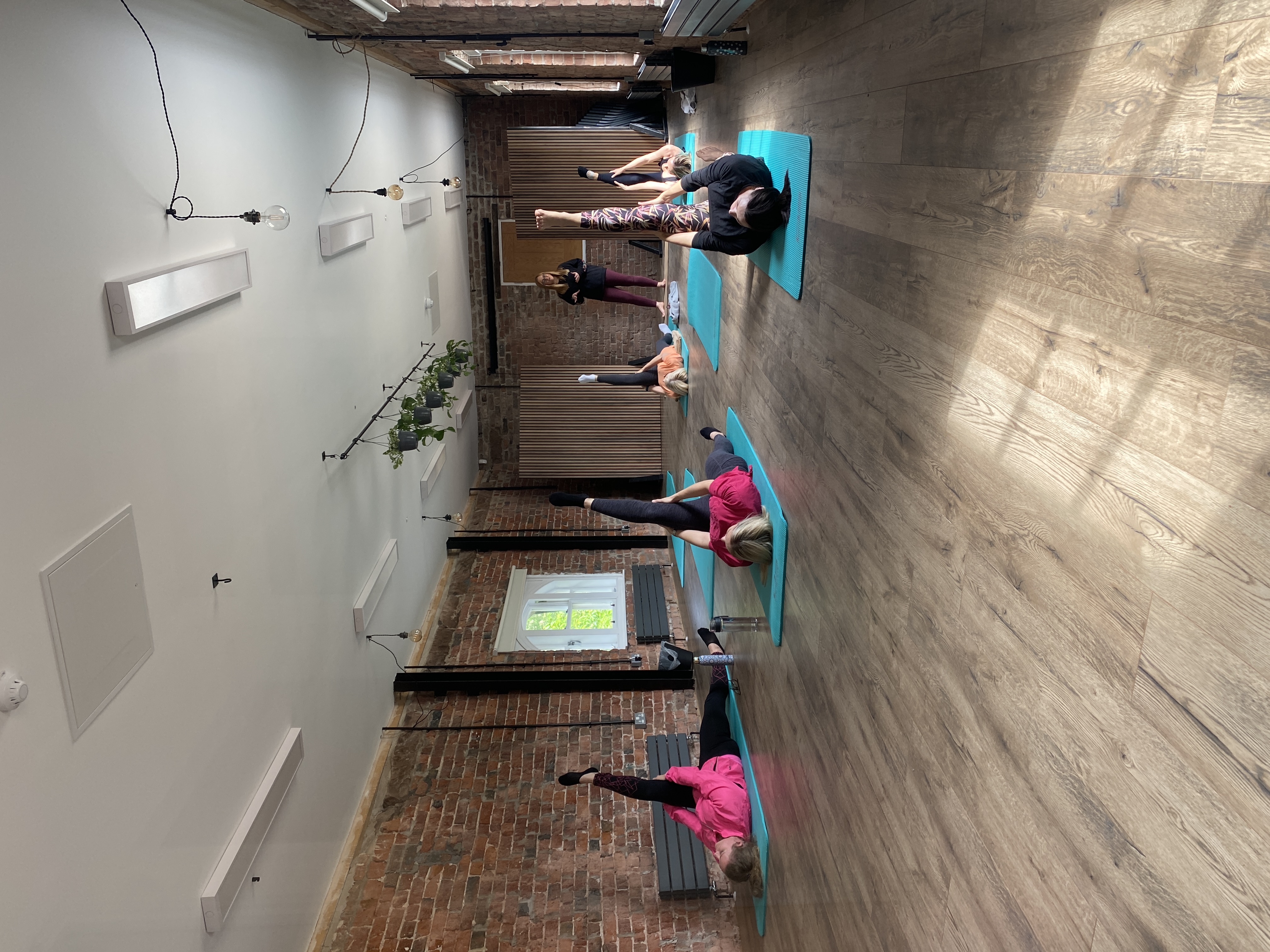 Wellness event at The Loft, Bowring Park: yoga session in a rustic venue.