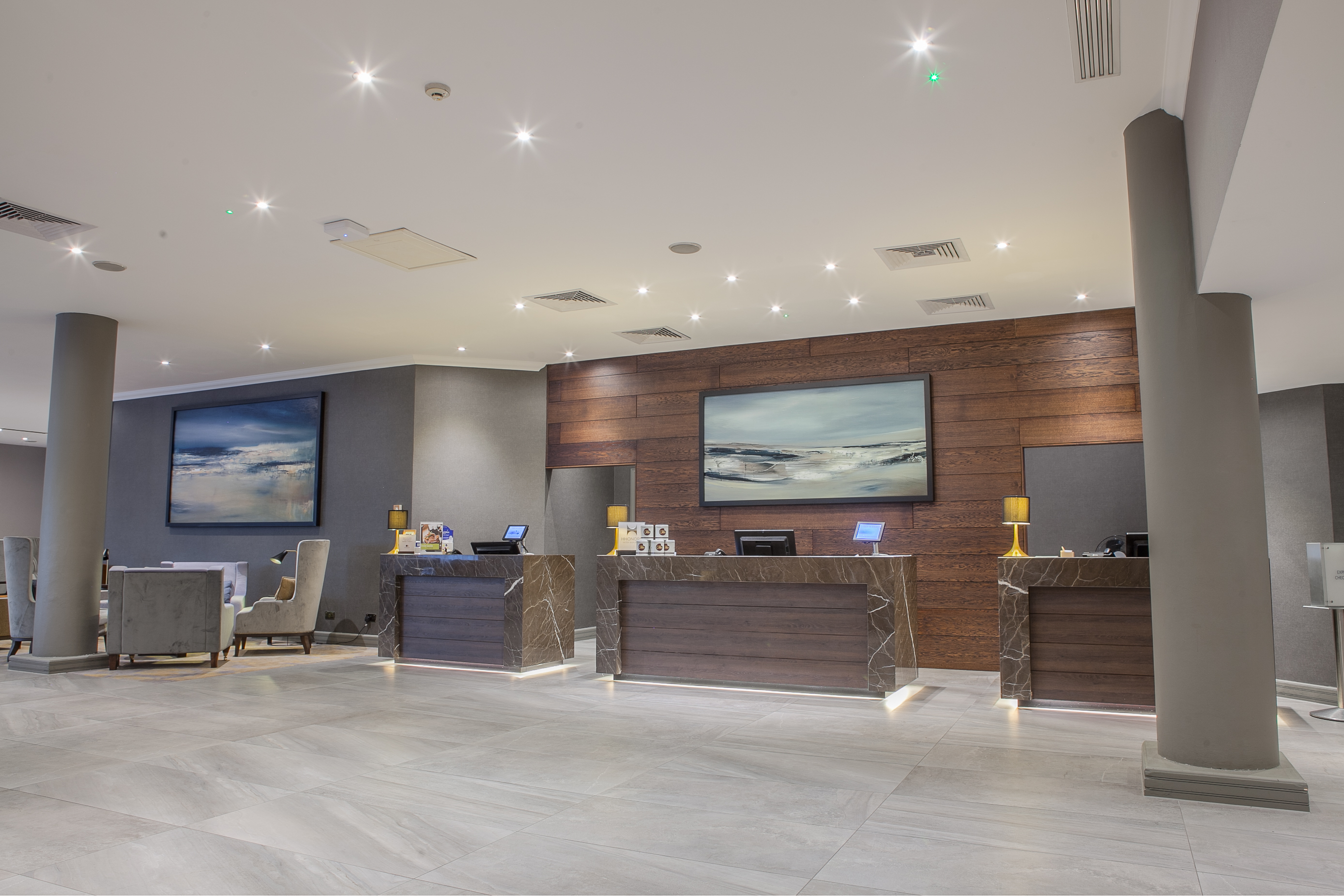 Modern hotel lobby at DoubleTree by Hilton Swindon, ideal for events and networking.