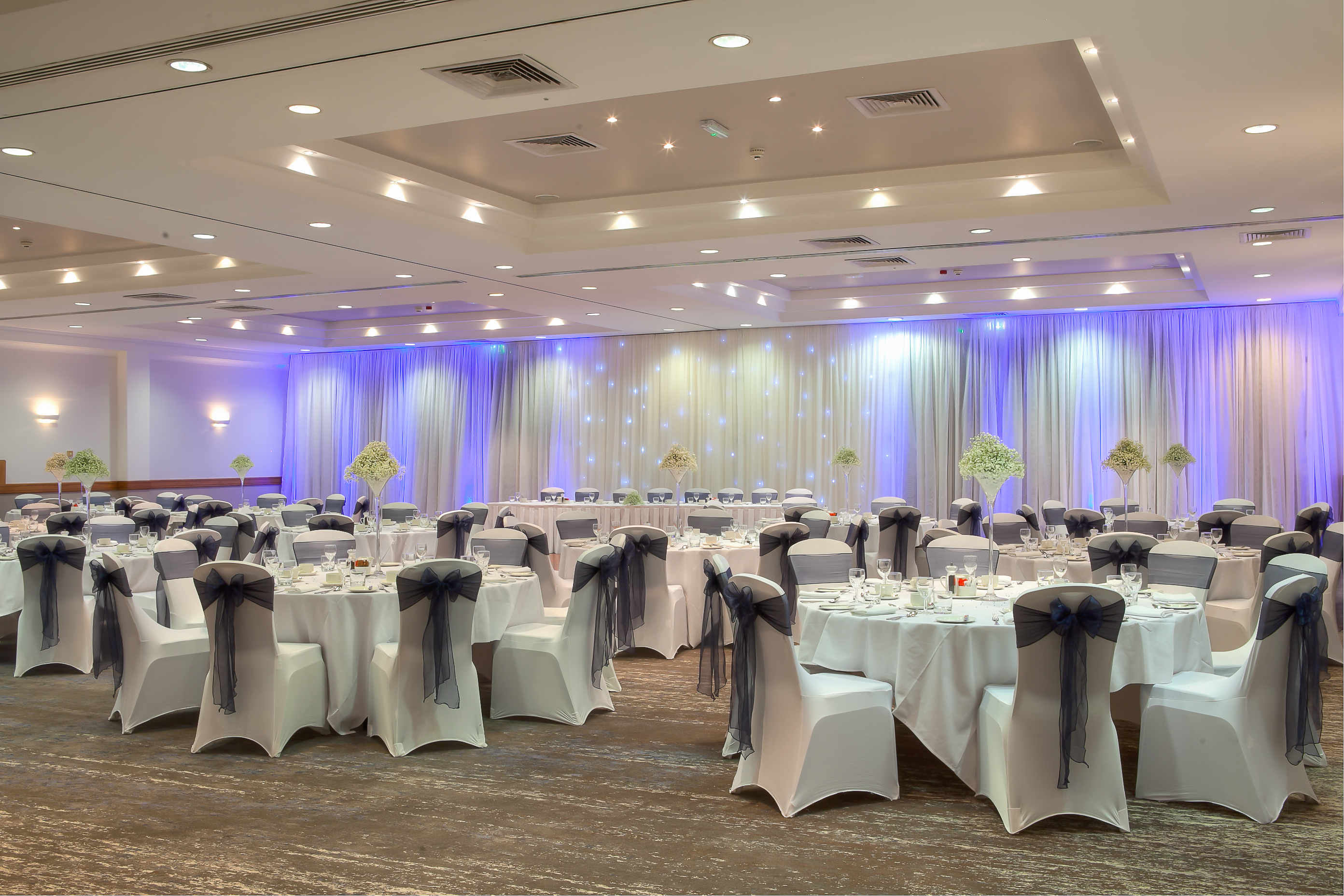 Lydiard Suite banquet hall with elegant tables, ideal for weddings and corporate events.