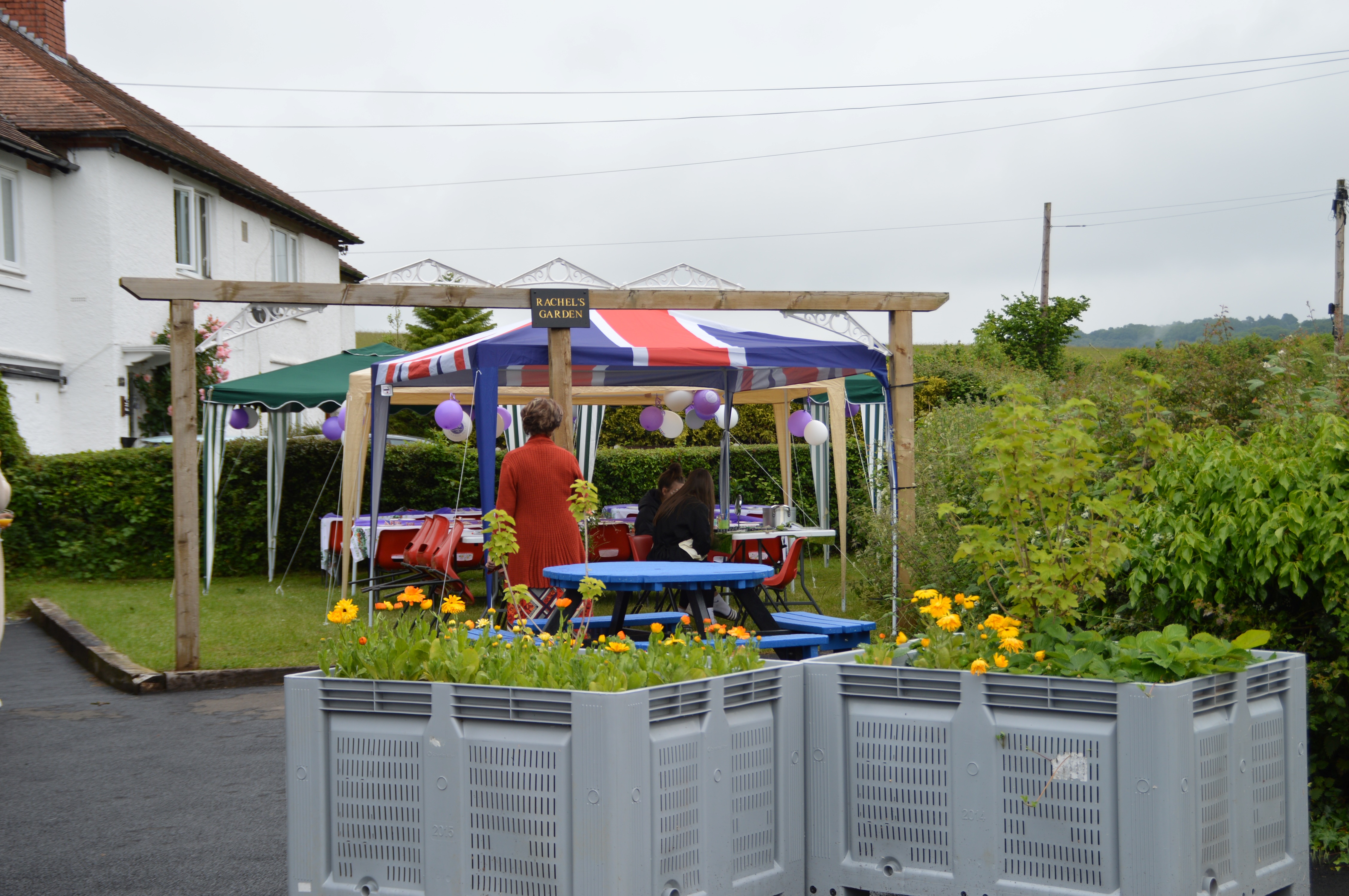 Eastham Memorial Hall outdoor event with colorful tents and Union Jack for community celebration.