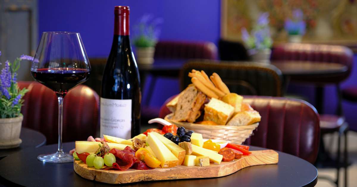 Charcuterie board with wine at Angéliques Wine House for networking events and receptions.