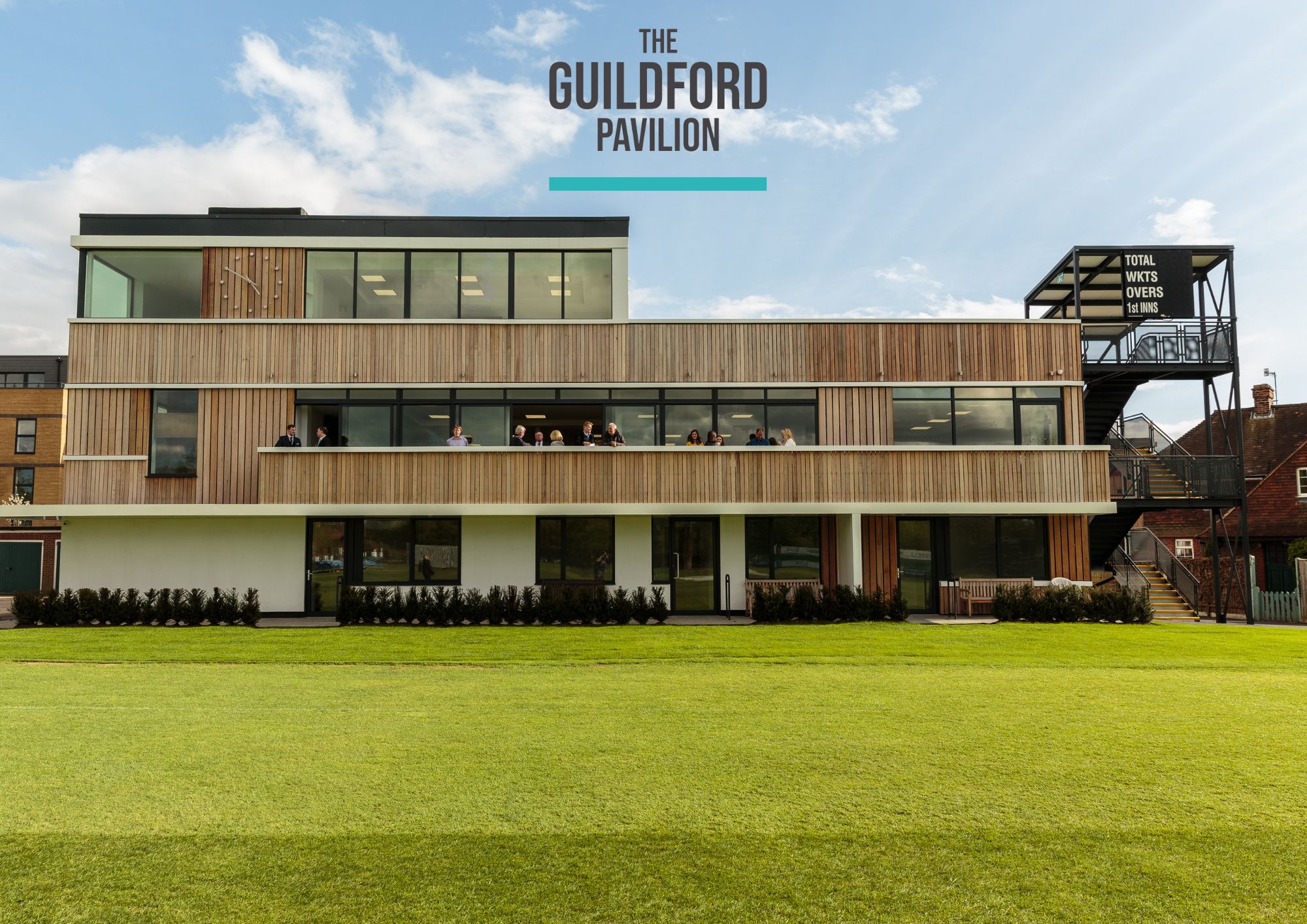 The Long Room at Guildford Pavilion, modern venue for events with expansive windows.