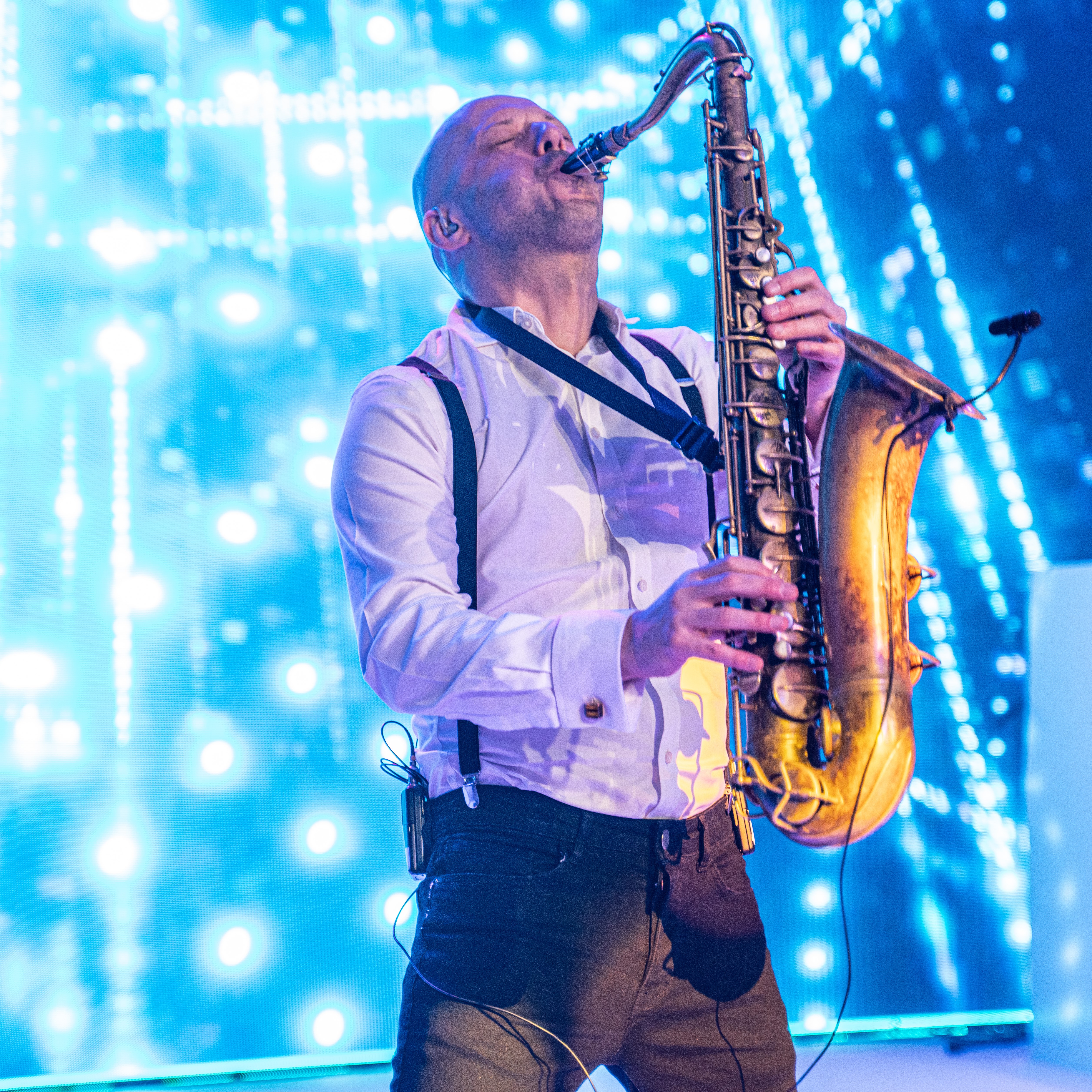 Saxophonist performing at Tottenham Hotspur Stadium Christmas party event.