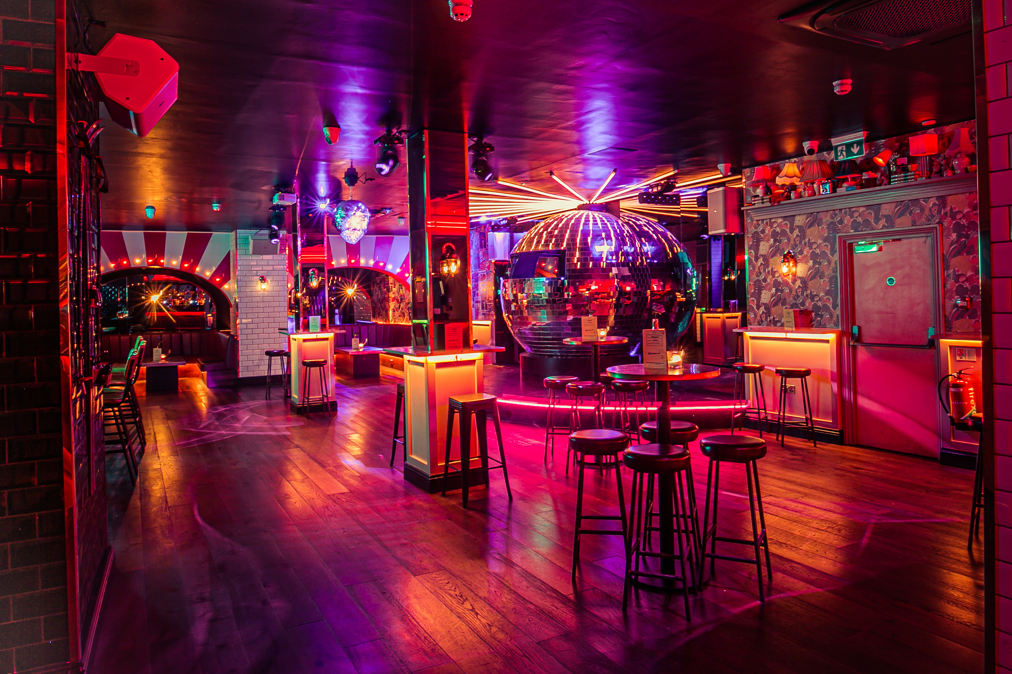 Vibrant event space at Simmons | Holborn with colorful lighting for social gatherings.