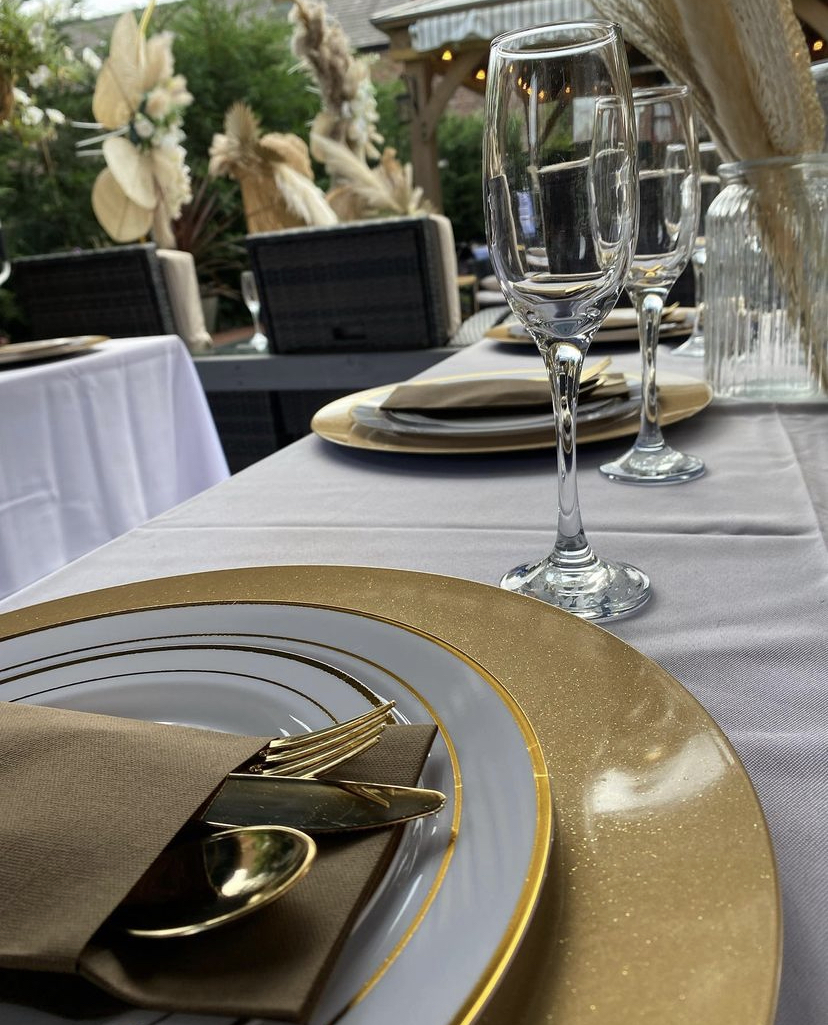 Elegant dining table with gold accents for upscale events and formal gatherings.