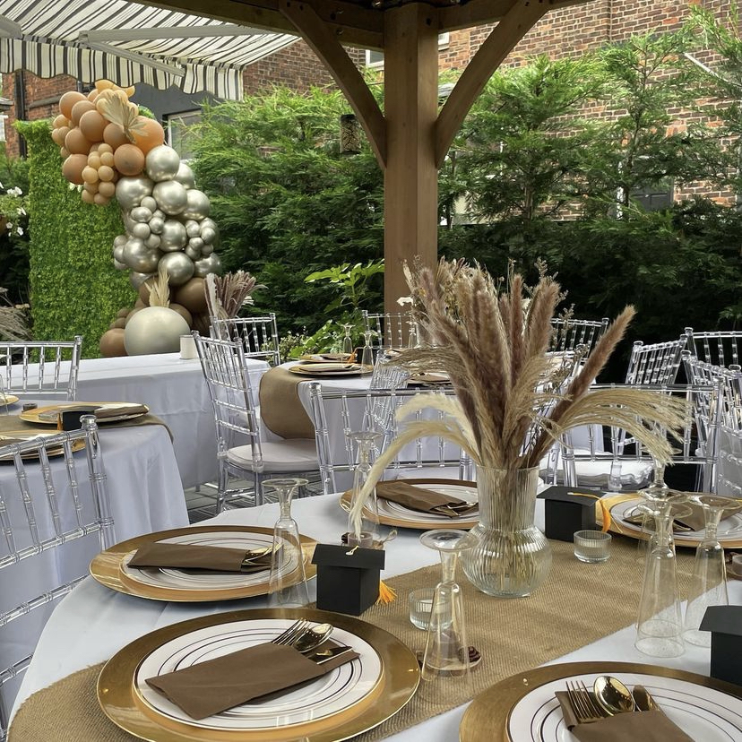 Elegant outdoor event space with pampas grass centerpieces for weddings and corporate events.