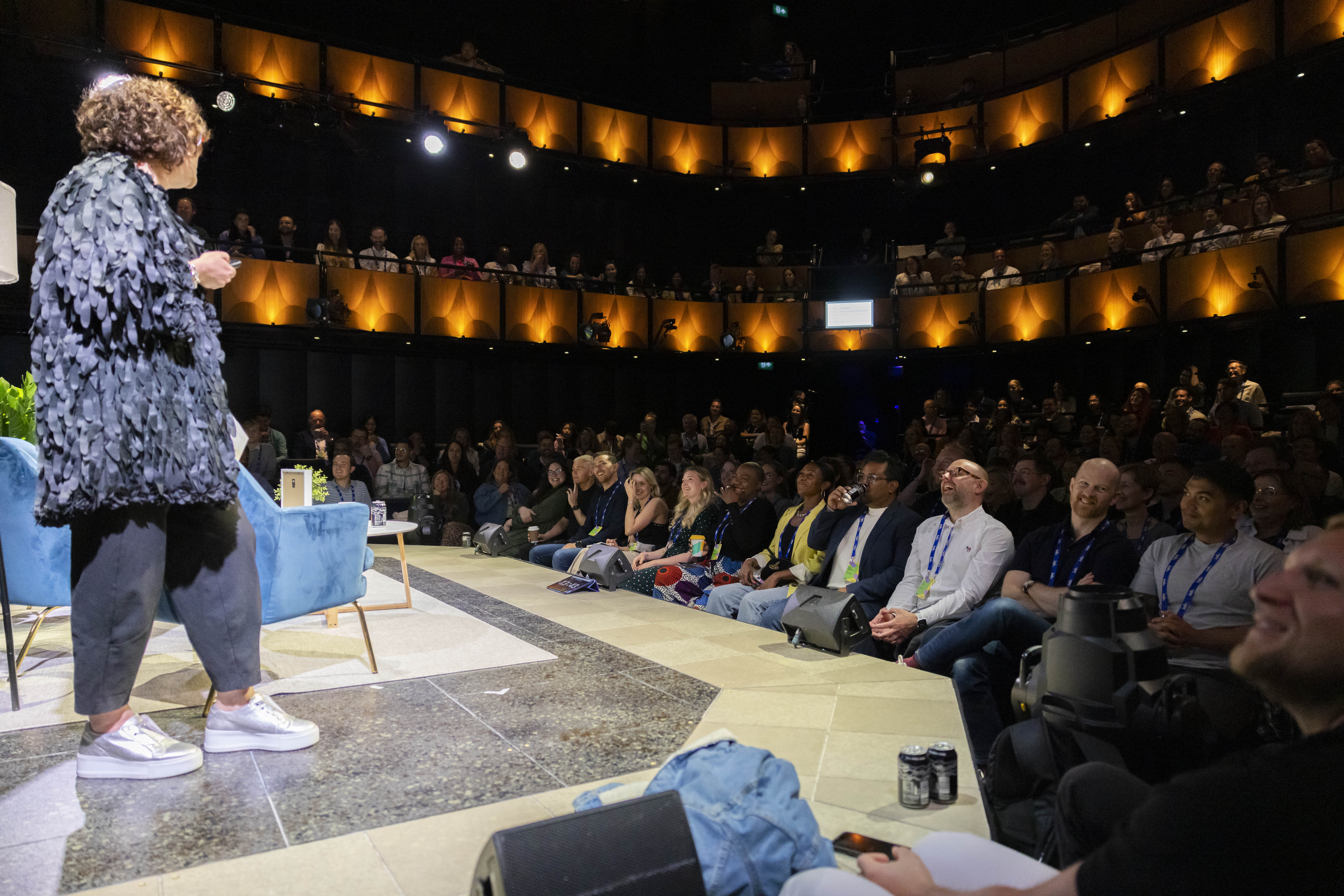 Dynamic speaker engaging audience in Sohoplace theatre, ideal for events and meetings.