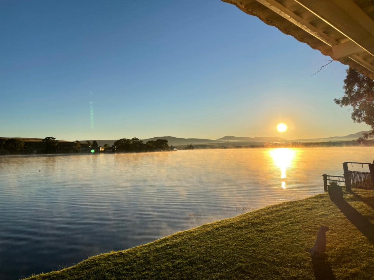 Serene lakeside sunrise at Emanzini Venues, ideal for outdoor events and retreats.