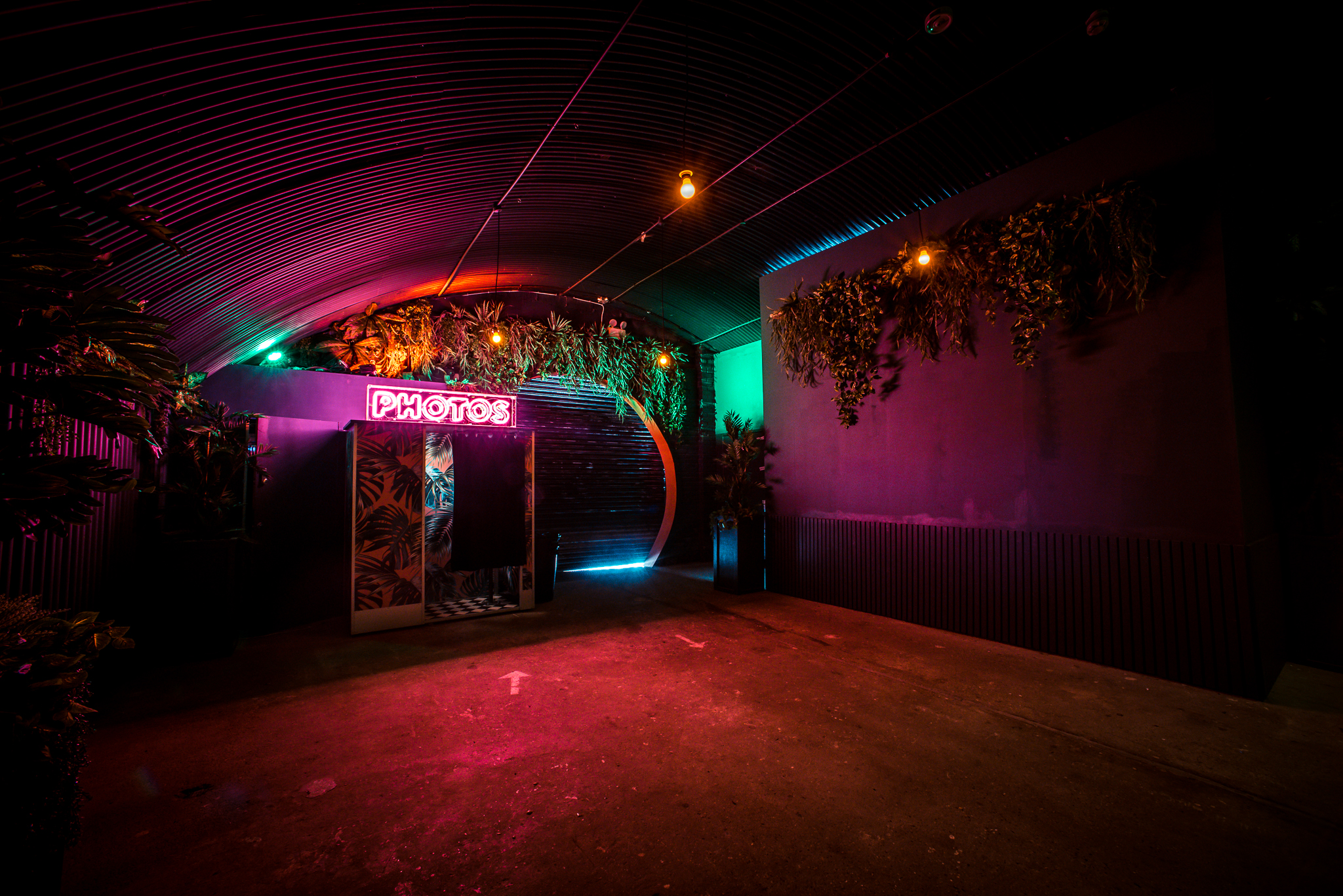 Vibrant Palm Bar venue with neon lights, perfect for nightlife and events.