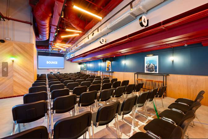 Conference space with black chairs, ideal for meetings and workshops at Battersea Power Station.