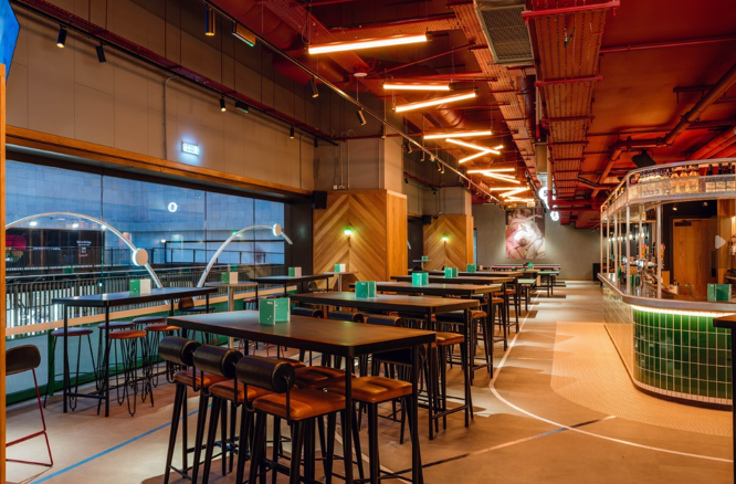 Modern conference space with high-top tables, ideal for networking events and gatherings.