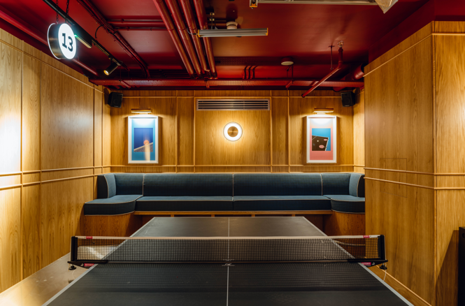 Stylish conference space with wood paneling for creative meetings at Bounce Battersea.