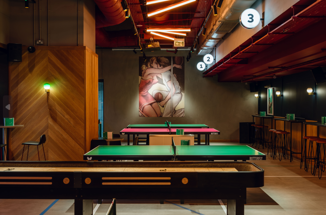 Vibrant conference space with pool tables for team-building events at Battersea Power Station.