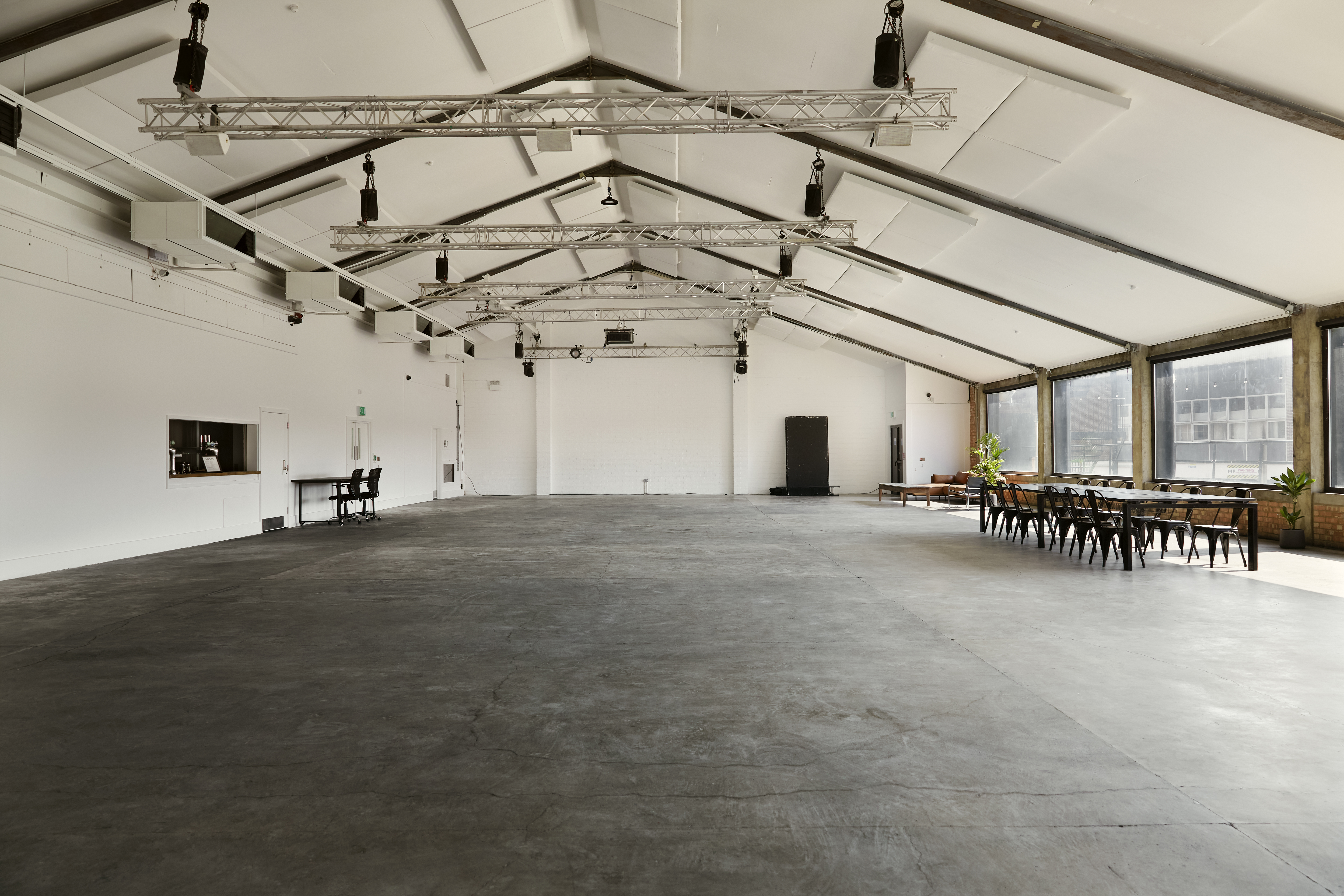 Spacious Lock Warehouse venue with high ceilings for corporate events and social gatherings.