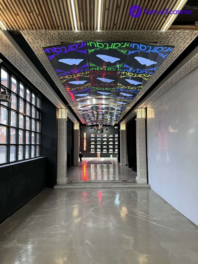 Modern event space with illuminated ceiling panels, ideal for corporate and creative gatherings.