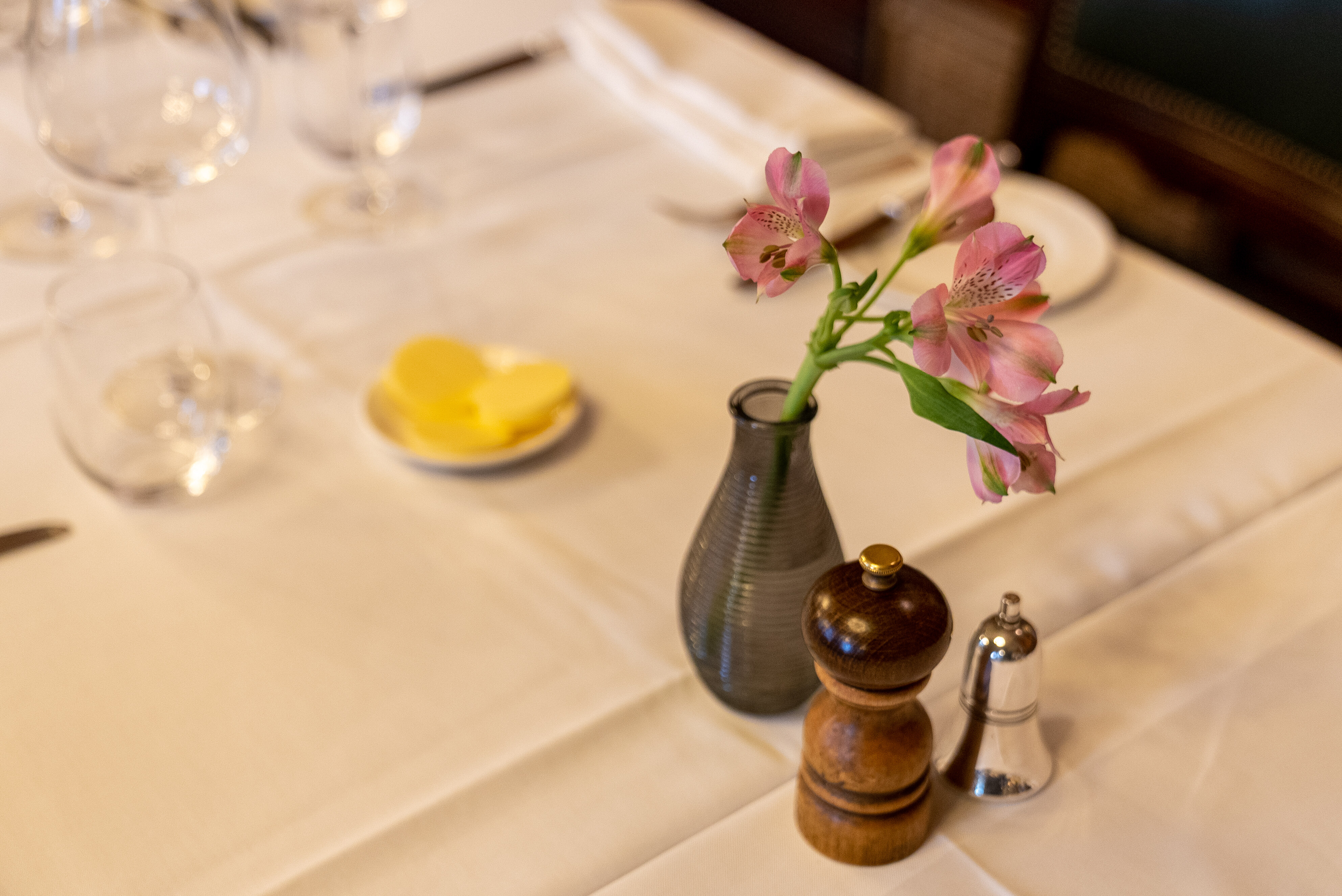Elegant dining table with floral centerpiece at National Liberal Club event.