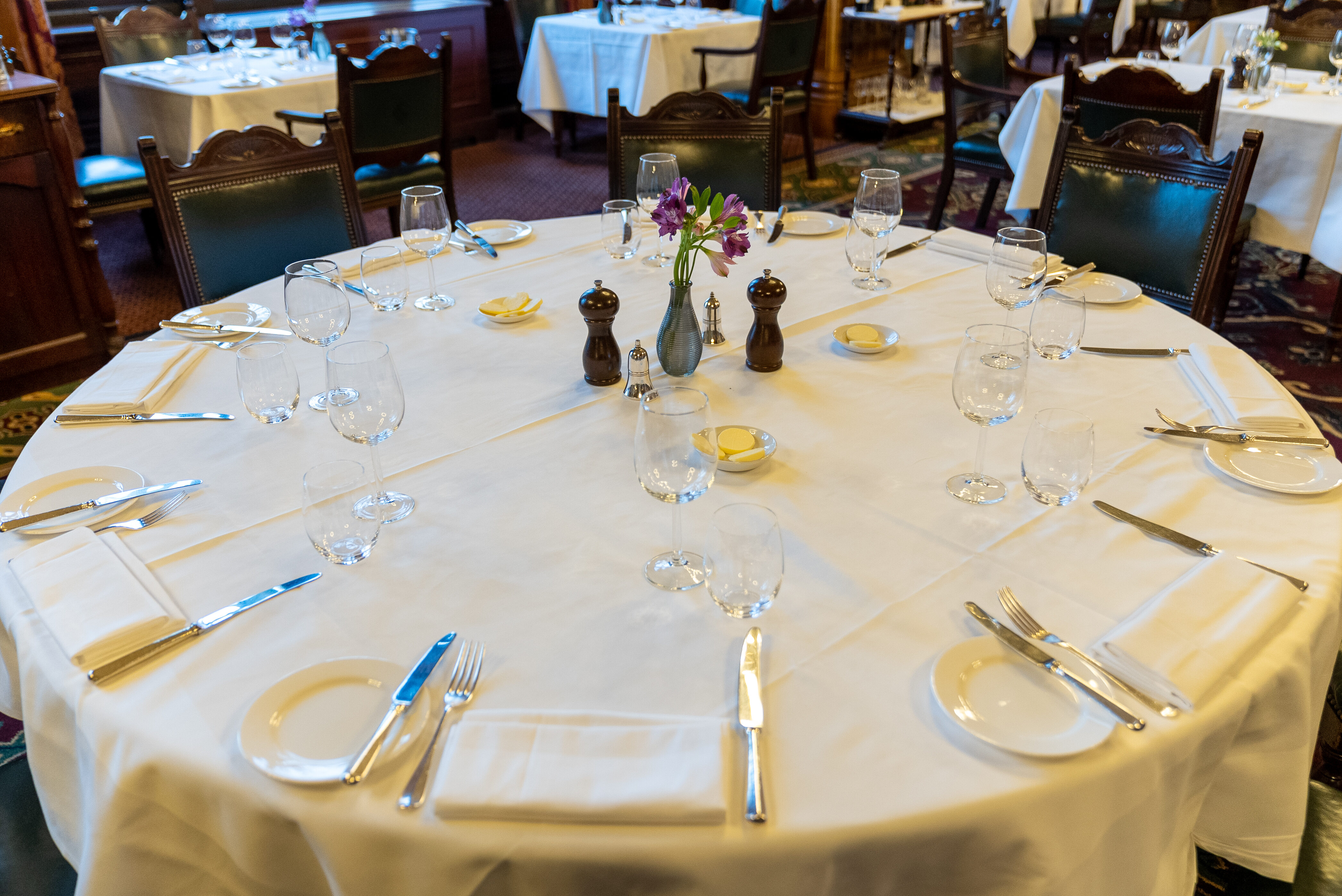 Elegant round dining table set for formal events at The National Liberal Club.