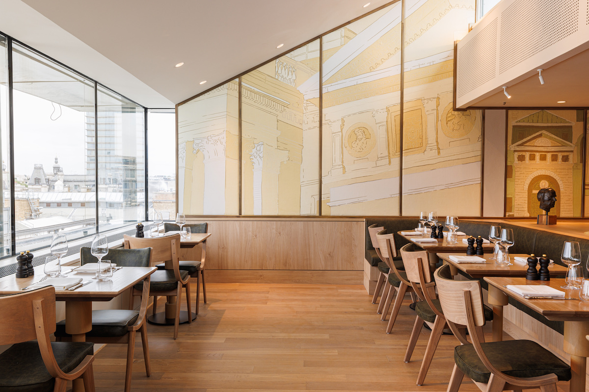 Modern dining space with large windows at The Portrait Restaurant for private events.