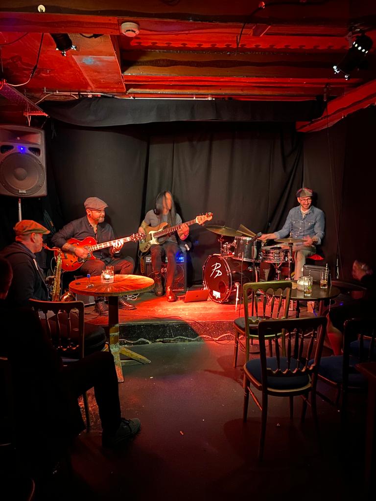 Cozy live music setting in Hoxton Cabin Basement for intimate gatherings and events.