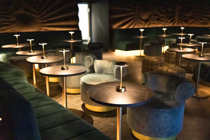 Stylish event space in Viajante with plush seating for cocktail receptions and gatherings.